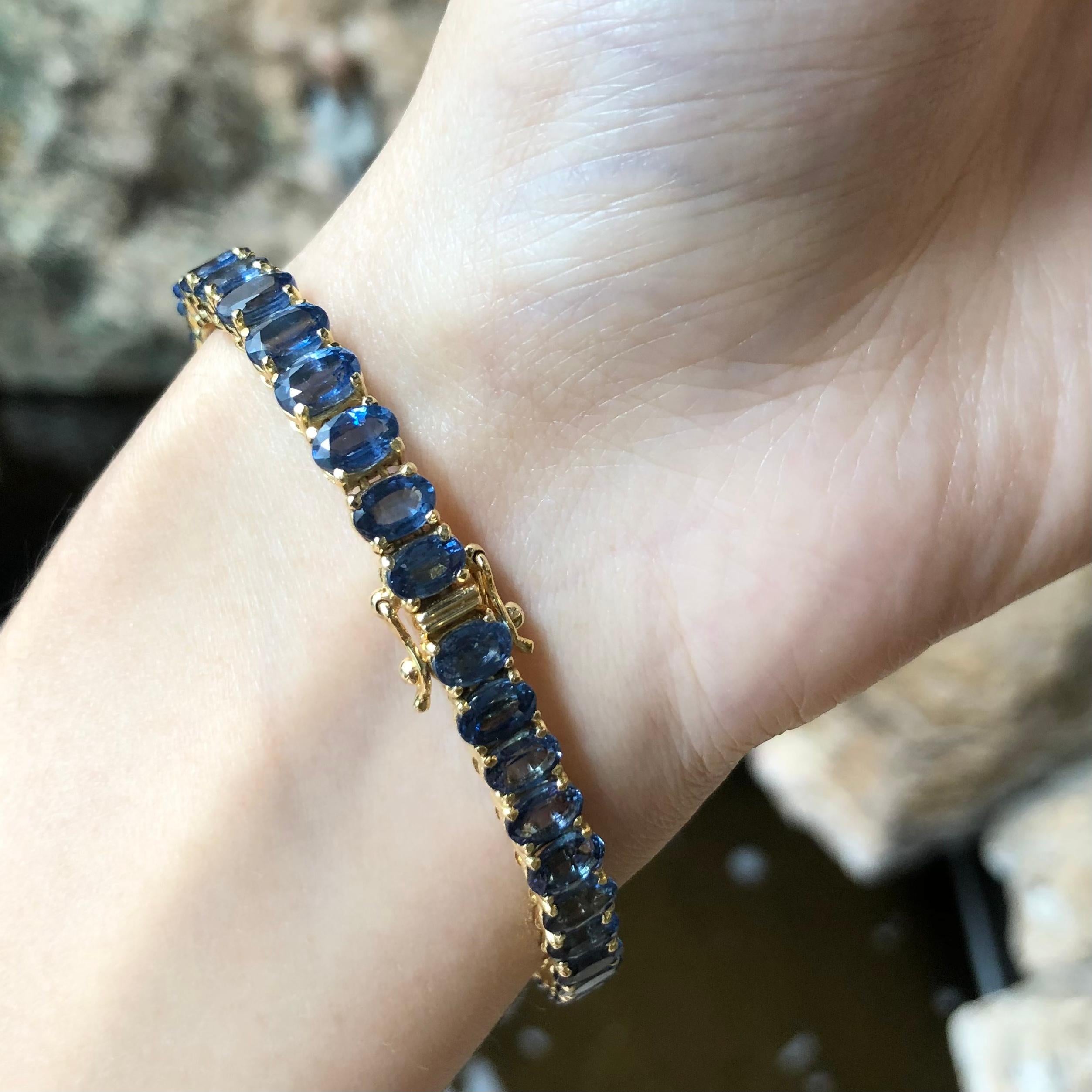 Blue Sapphire 23.37 carats Bracelet set in 14 Karat Gold Settings

Width:  0.6 cm 
Length: 17.5 cm
Total Weight: 21.05 grams

