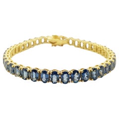 Bracelet de saphirs bleus sertis dans des montures en or 14 carats