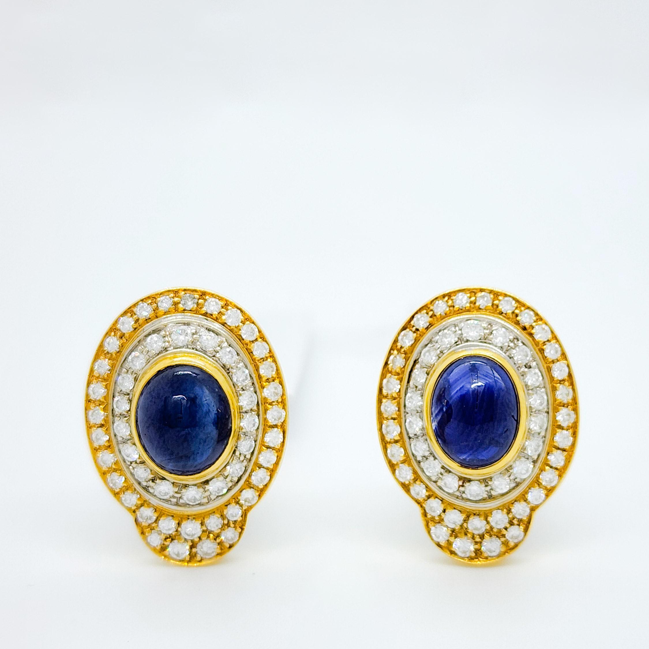 Beautiful 4.00 ct. blue sapphire oval cabochons with 3.00 ct. good quality white diamond rounds.  Handmade in 18k yellow and white gold.