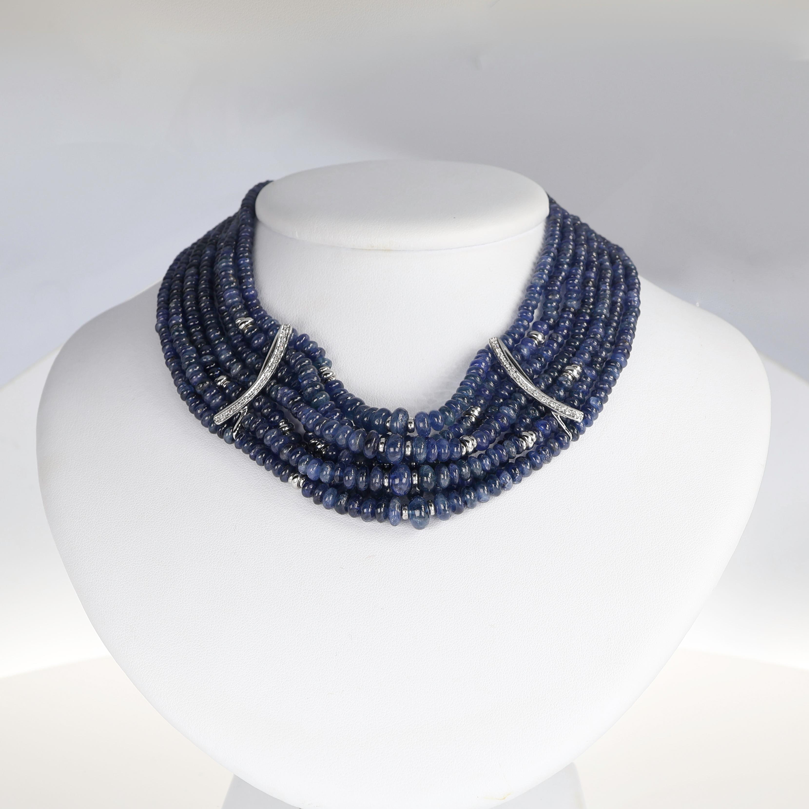 A bold and sophisticated choker necklace, featuring an impressive 375 carats of deep blue cabochon-cut sapphires. The multi-strand composition is accented with 0.57 carats of brilliant-cut diamonds, set in refined details that enhance the piece’s