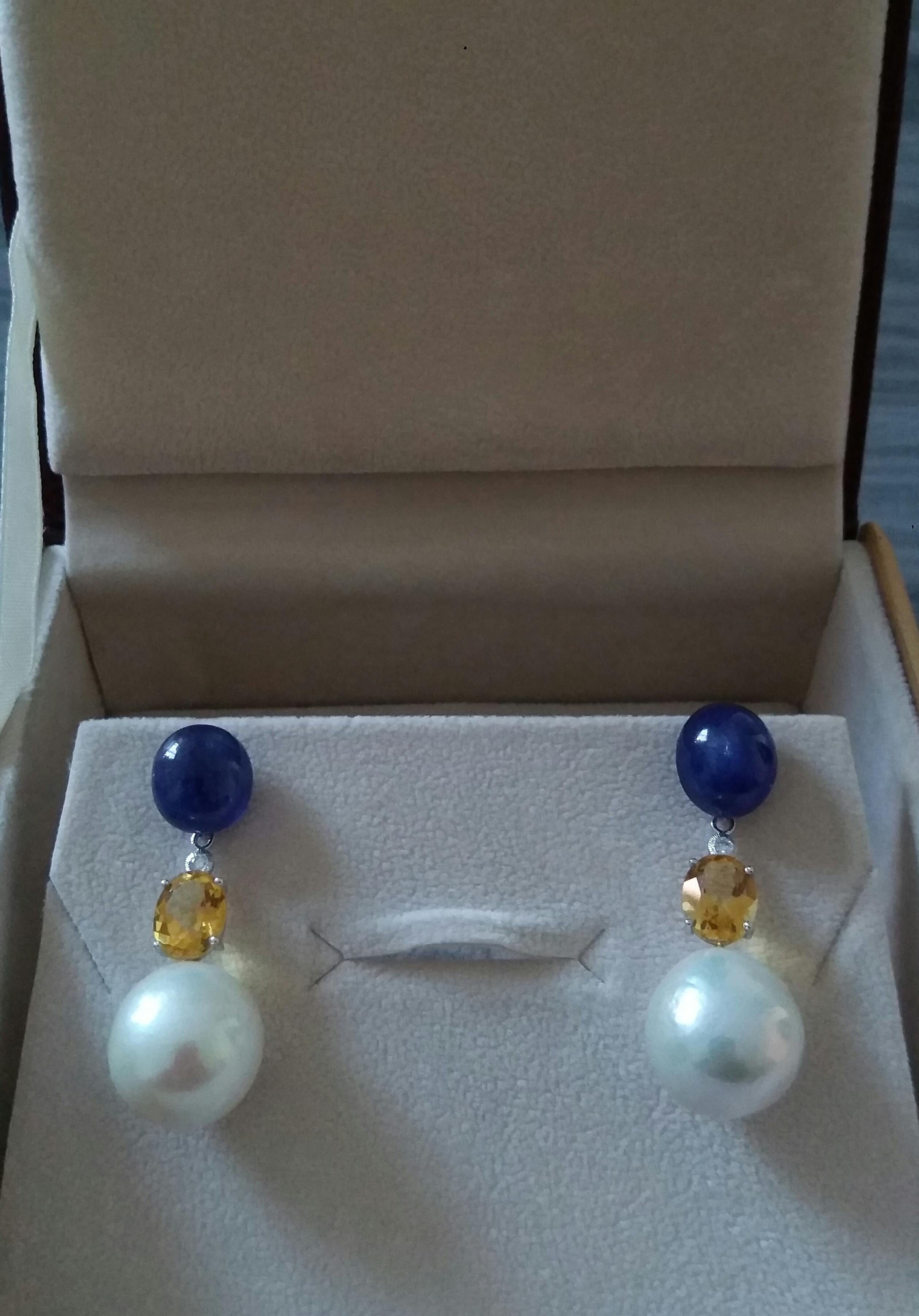 The upper part of these earrings, composed of 2 large ruby cabochons and 2 oval faceted citrine quartz, with in the middle 2 small full cut diamonds, supports a pair of white baroque pearls with a diameter of 13 mm
In 1978 our workshop started in