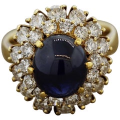 Blue Sapphire Cabochon Diamond Cluster Gold Ring