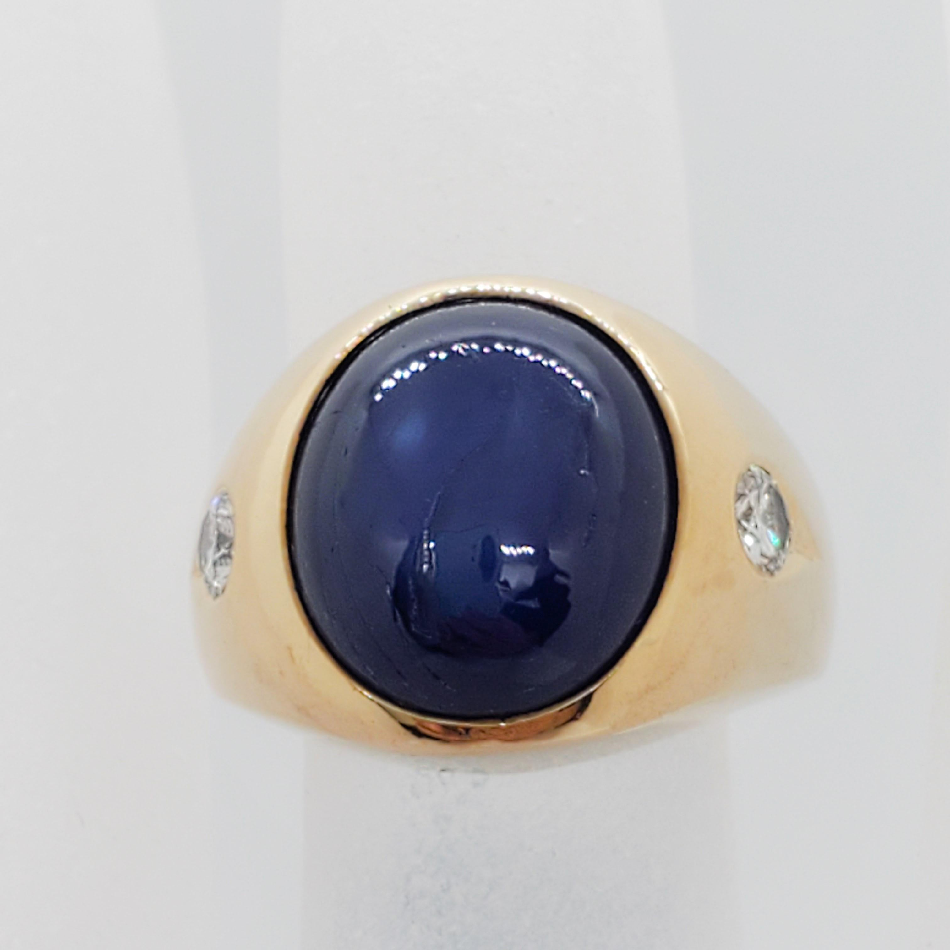 Beautiful deep blue sapphire oval cabochon weighing 8.50 cts with good quality, white, and bright diamond rounds weighing 0.25 cts.  Ring size is 6.5.  Handmade in 14k yellow gold.