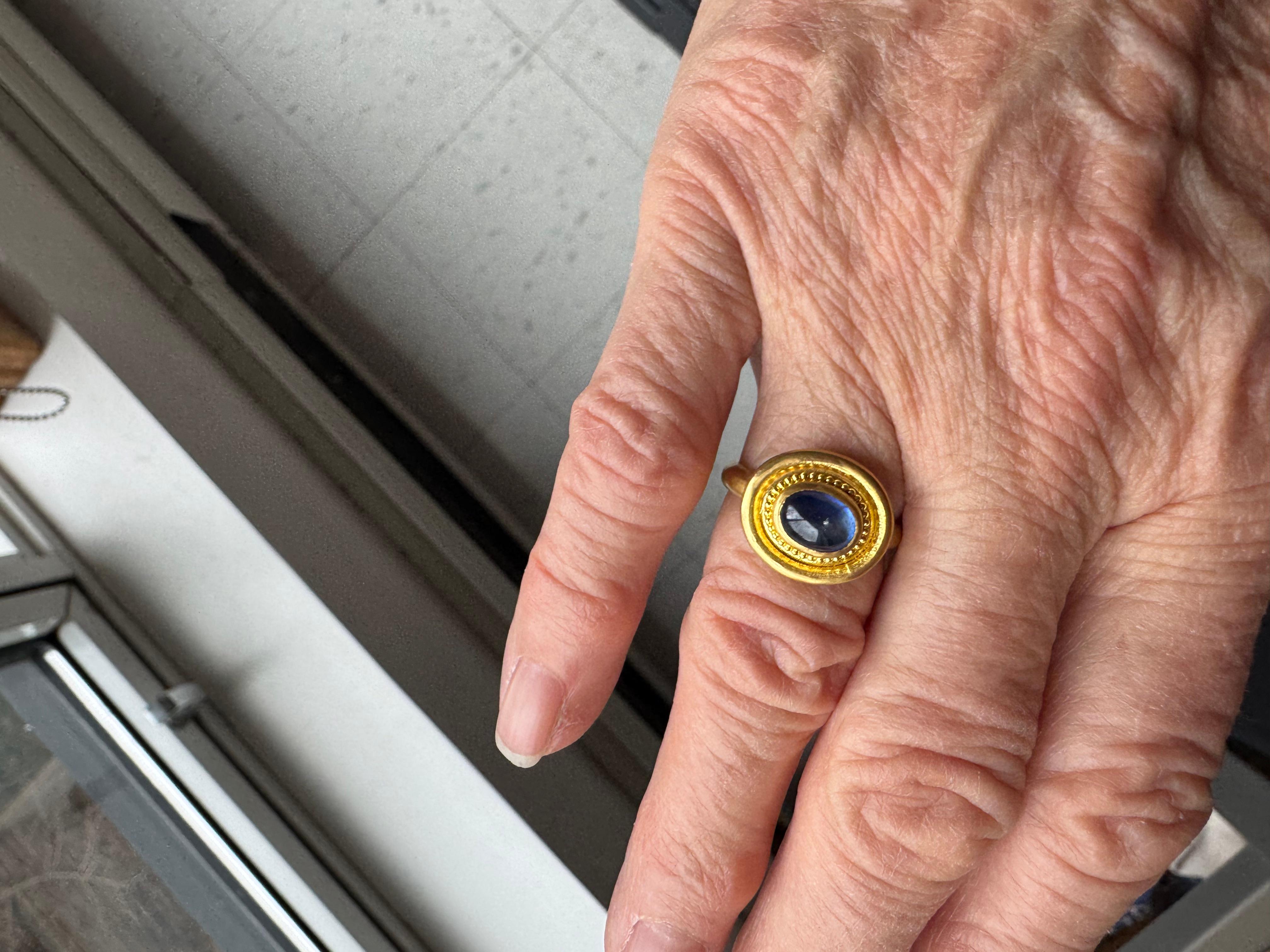 Natural blue sapphire cabochon ring, set in 22 karat gold with granulation accent.
The word ‘sapphire’ comes from the Greek word sapphirus which means blue, traditionally gifted on 5th and 45th wedding anniversaries, blue sapphire is said to bring