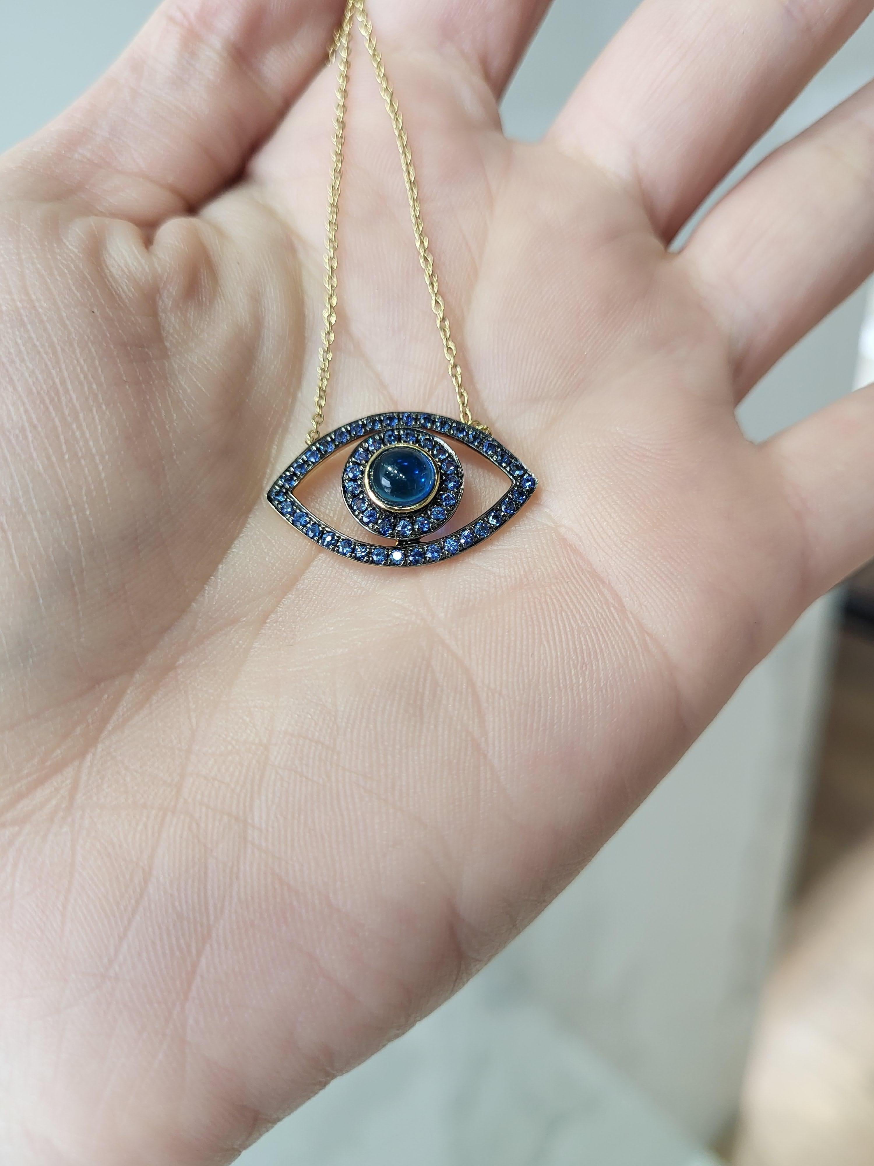 Blue Sapphire Cabochon & Round Sapphire 14k Yellow Gold Evil Eye Pendant In New Condition For Sale In Houston, TX