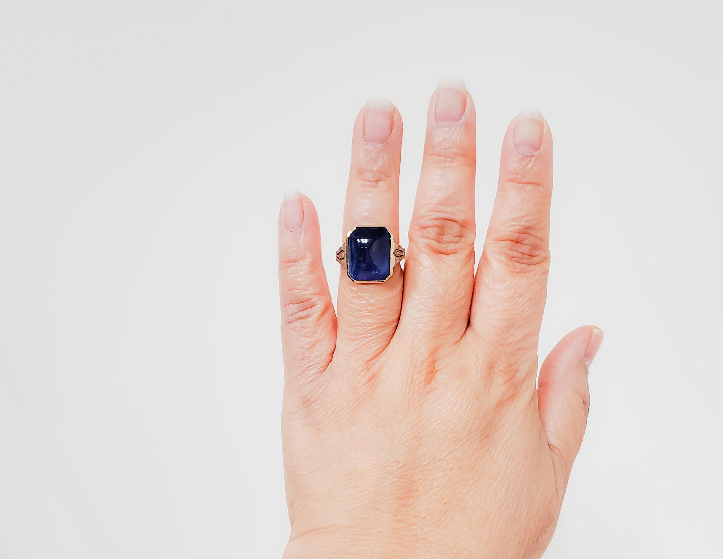 Gorgeous 15.38 ct. blue sapphire cabochon sugarloaf in a handmade 18k white and yellow gold mounting.  Ring size 7.