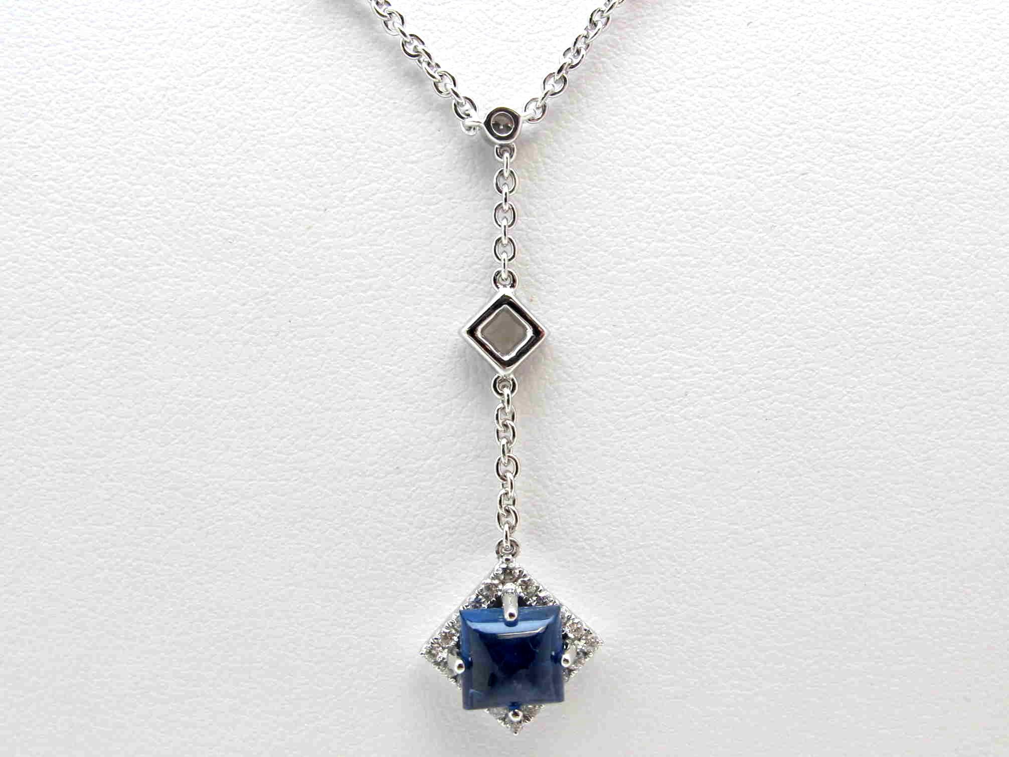 Stylish and elegant, this diamond and sapphire drop necklace is absolutely beautiful! Sometimes less is more, and that is evident in the masterful creation of this piece. This necklace is set with a deep blue sapphire cabochon and fine quality