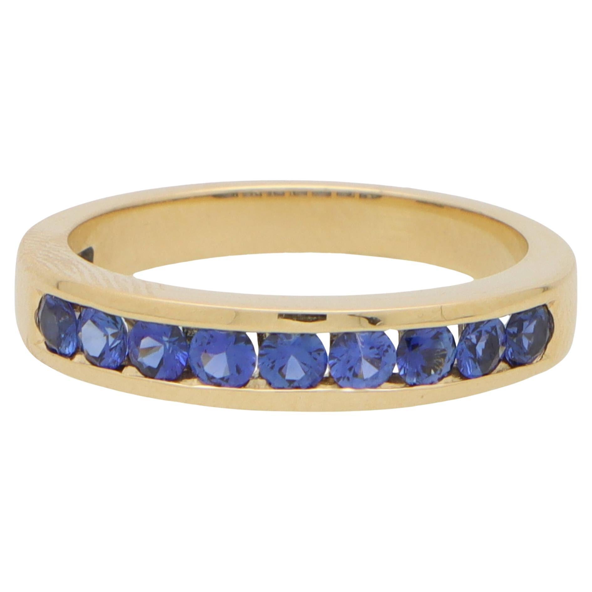 Blue Sapphire Channel Set Half Eternity Ring in 18k Yellow Gold For Sale