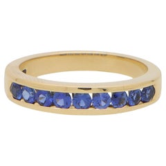 Blue Sapphire Channel Set Half Eternity Ring in 18k Yellow Gold