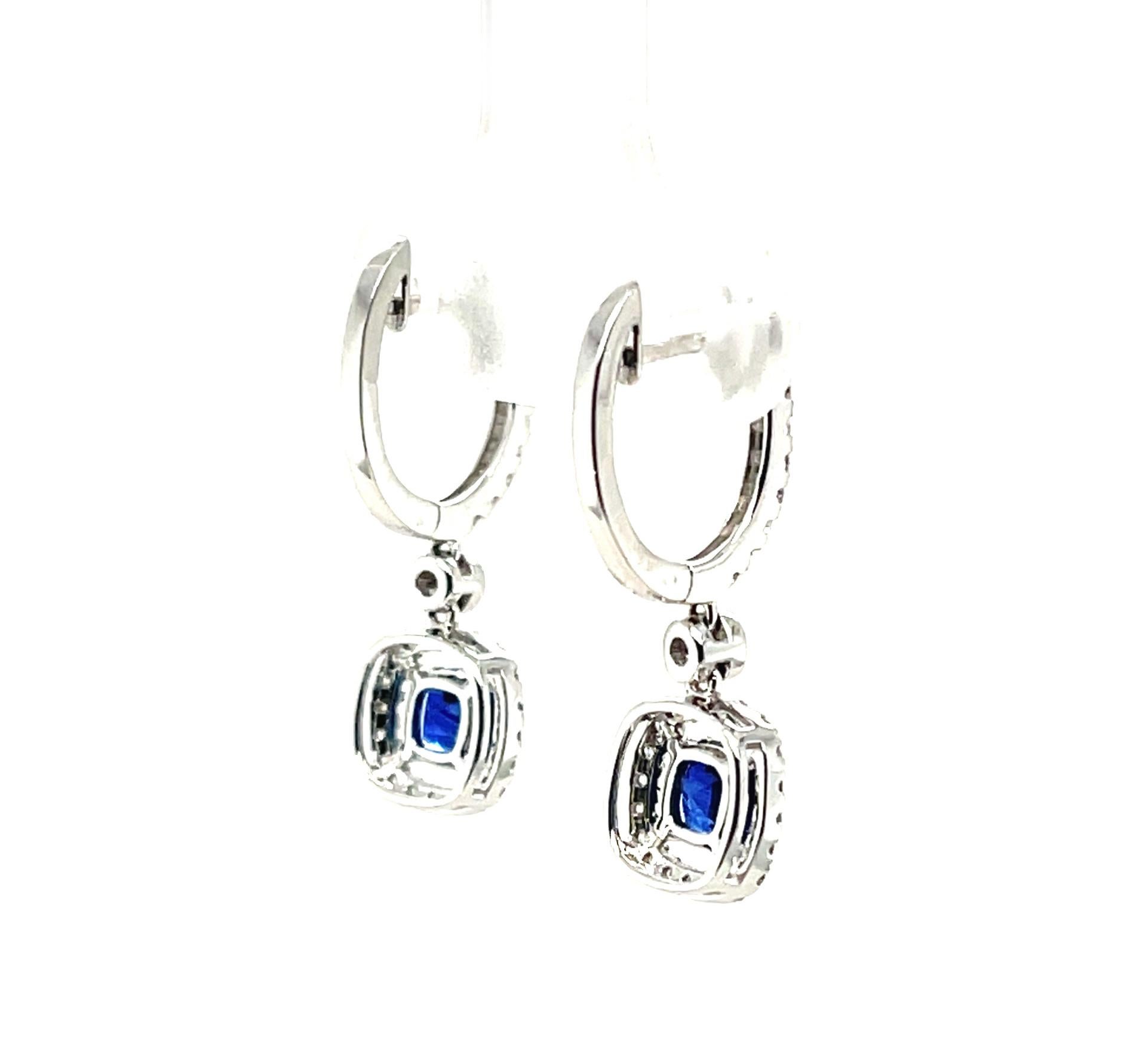 Round Cut Blue Sapphire and Diamond Halo Dangling Drop Earrings in White Gold