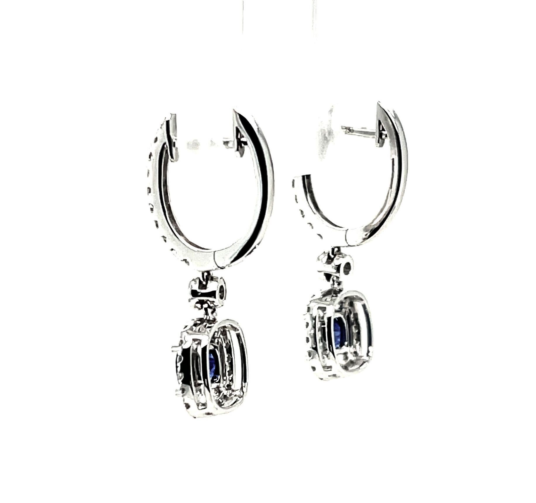 Blue Sapphire and Diamond Halo Dangling Drop Earrings in White Gold In New Condition In Los Angeles, CA