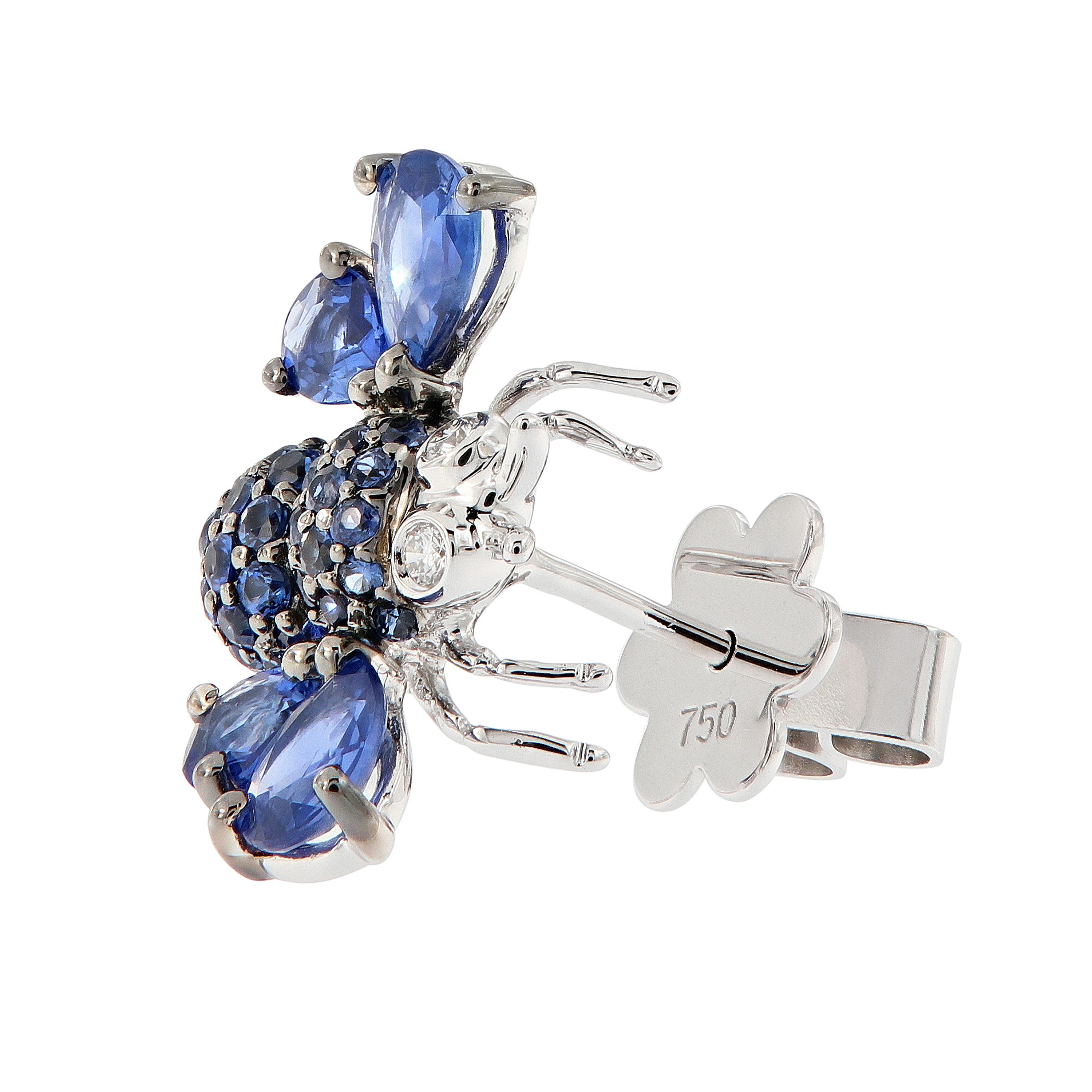 Beautiful bee earrings expertly crafted in 18k white gold. Round cut blue sapphires accent the body of the bee with pear shaped blue sapphire wings and diamond eyes. Weigh 5.4 grams.

Sapphires 2.75 cttw
Diamonds 0.05 cttw
