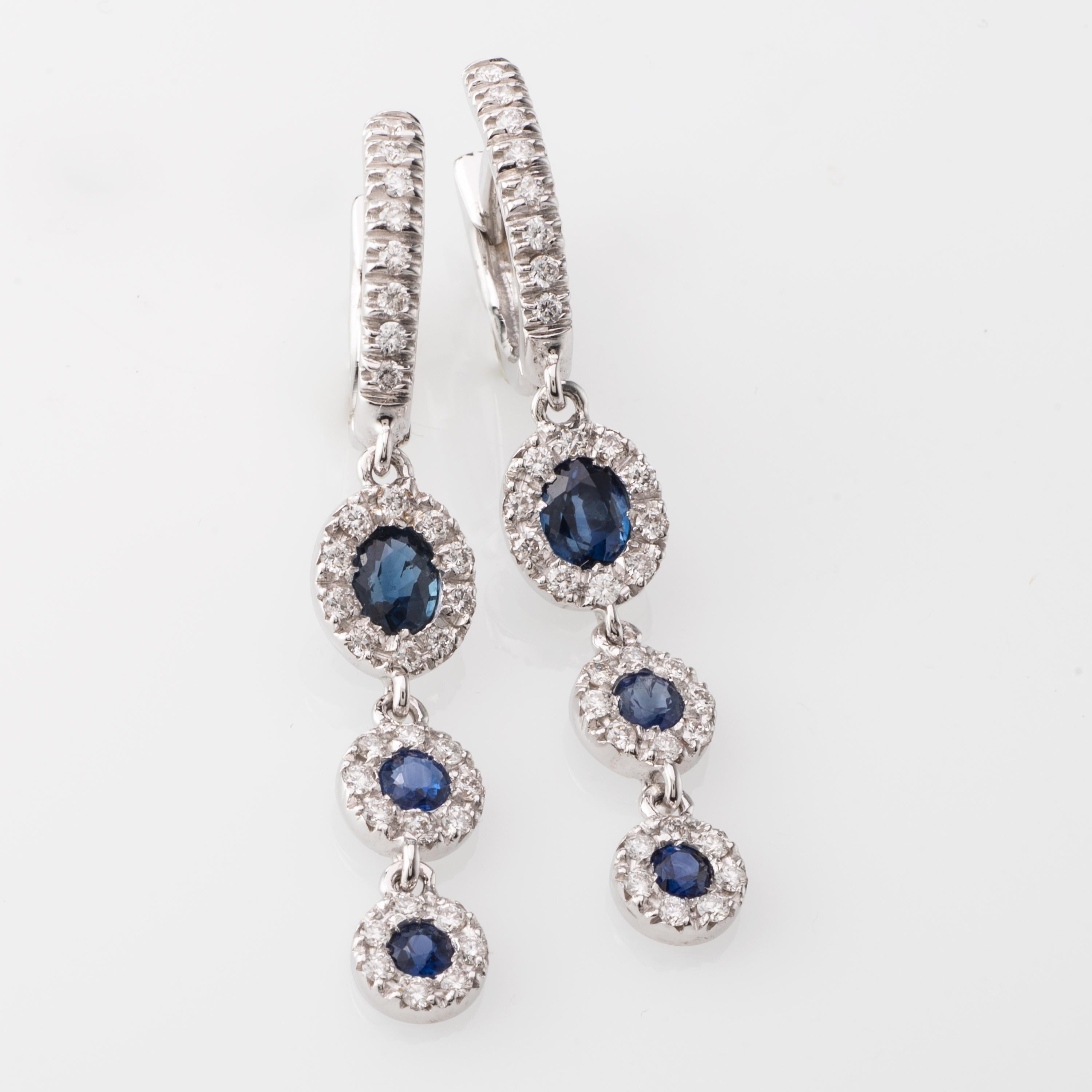 Elegant Blue Sapphire and Diamond Earrings set in White Gold.
Sapphires 0.84 Carat, Diamonds 0.39 Carat.
Customisation of gold colour, stones is possible. We can custom make this item according to your taste. 
These earrings can be set with Emeralds