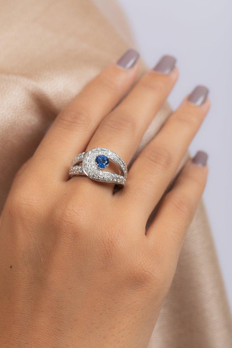 This ring has been meticulously crafted from 18-karat white gold.  It is hand set with 1.09 carat blue sapphire & 1.21 carats of sparkling diamonds. 

The ring is a size 7 and may be resized to larger or smaller upon request. 
FOLLOW  MEGHNA JEWELS