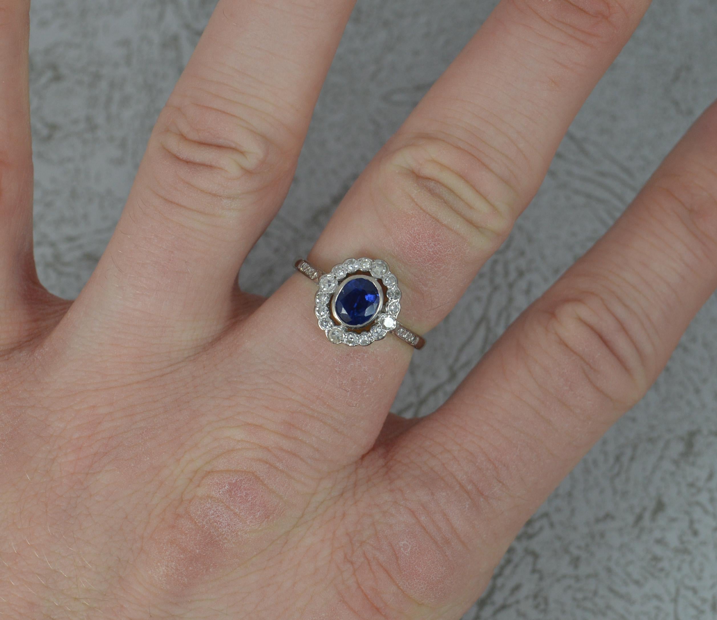 A beautiful Sapphire and Diamond ring.
Solid 18 carat white gold shank and head.
Designed with a 5.2mm x 6.3mm oval blue sapphire in collet setting to centre. Surrounding are 16 natural round brilliant cut diamonds all in bubble bezel settings.
To