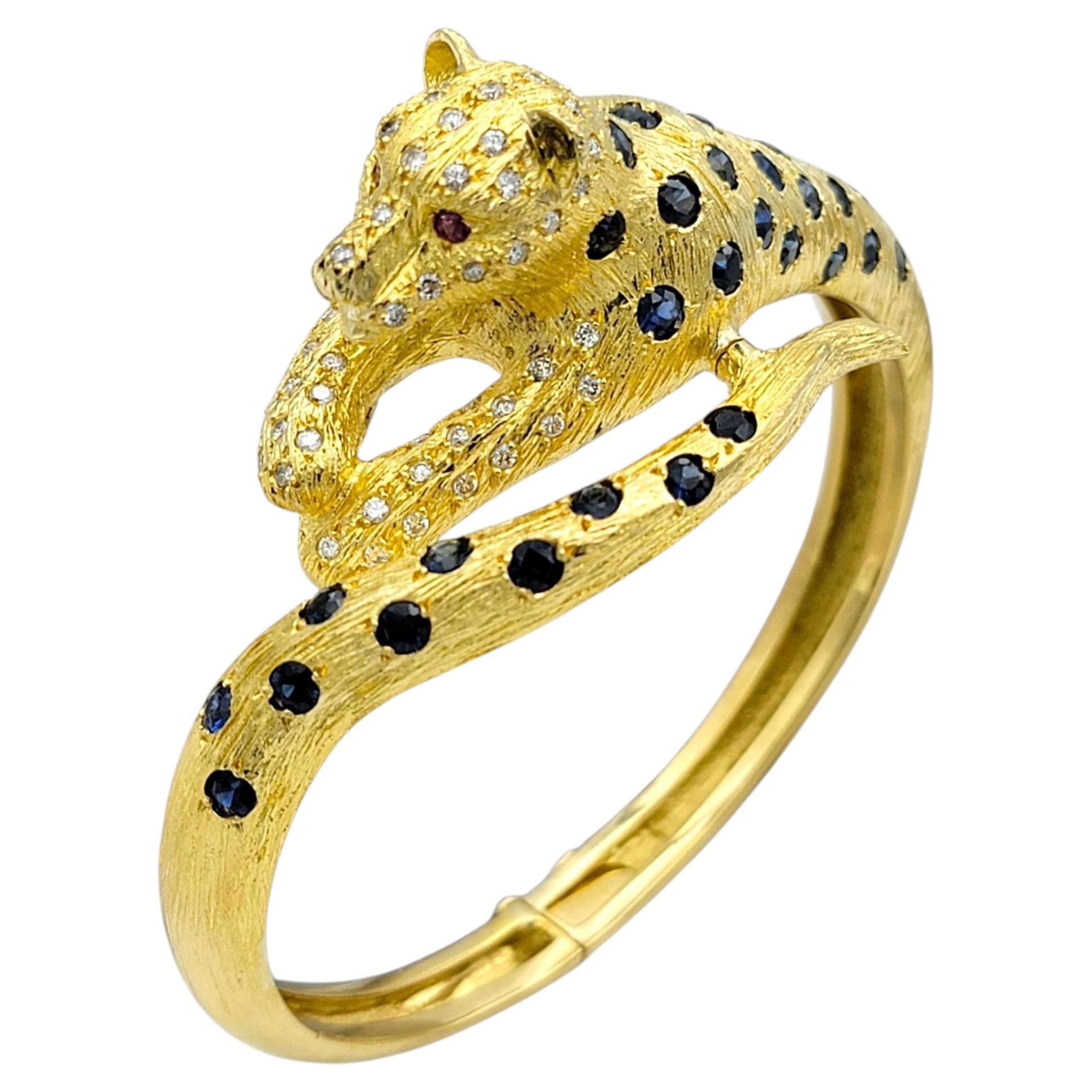 Blue Sapphire, Diamond and Ruby Panther Bangle Bracelet in 18 Karat Yellow Gold For Sale
