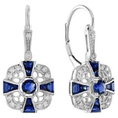 Orecchini Omega con diamante e zaffiro blu in stile Art Deco in oro bianco 14 carati