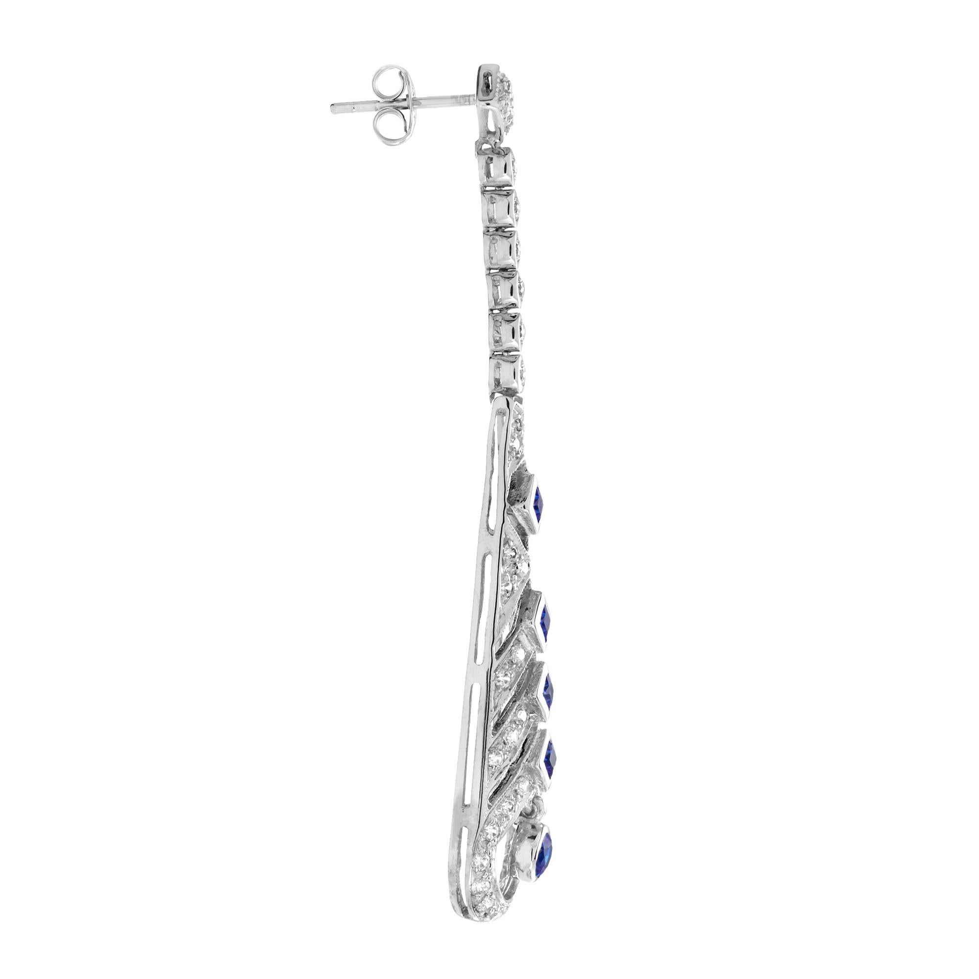 A fabulous pair of sapphire and diamond Art Deco design earrings. Typically Deco, these wonderful earrings have round and square sapphire with diamonds. They are beautifully elegant when worn as they have wonderful movement. 14K White Gold.
