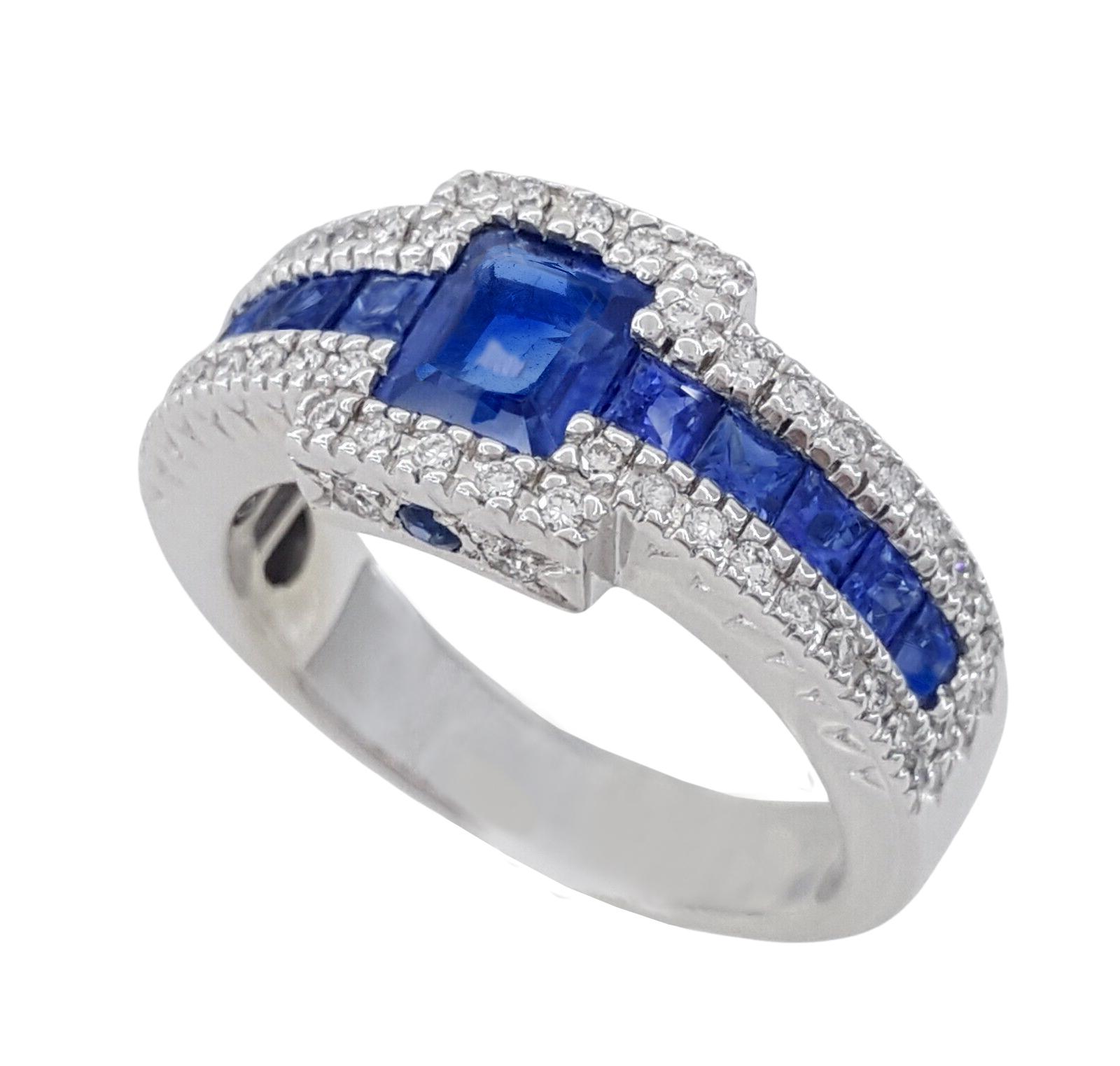 2.45 ct Total Weight Natural Blue Sapphire & Round Diamond Ring in 18K White Gold.



The ring weighs 8.2 grams, size 7, the center is a Natural Vivid Blue Color Emerald Cut Sapphire weighing approximately 1.1 ct.



there are 10 Natural Princess &