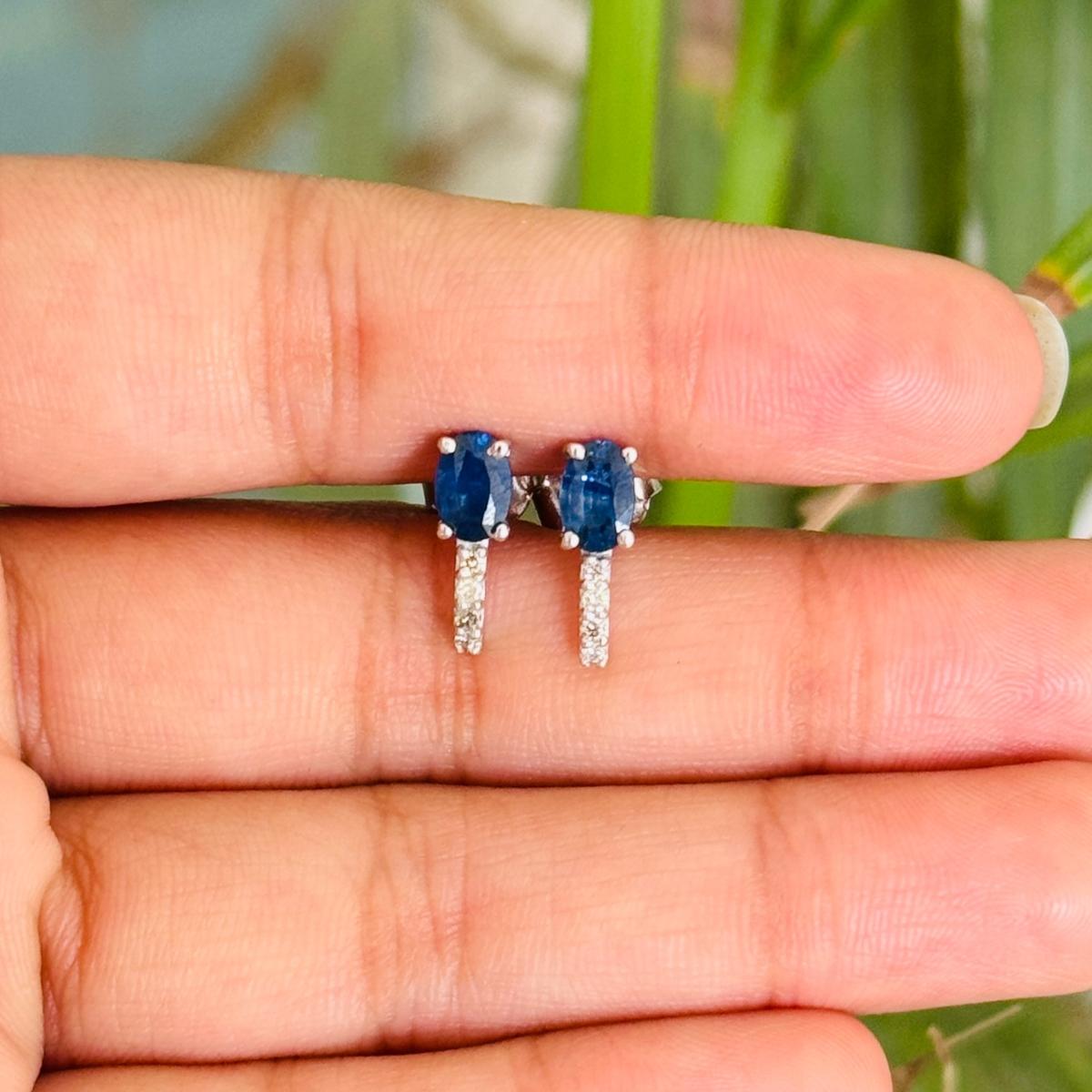 Blue Sapphire Diamond Dainty Stud Earrings in sterling silver to make a statement with your look. You shall need stud earrings to make a statement with your look. These earrings create a sparkling, luxurious look featuring oval cut natural blue