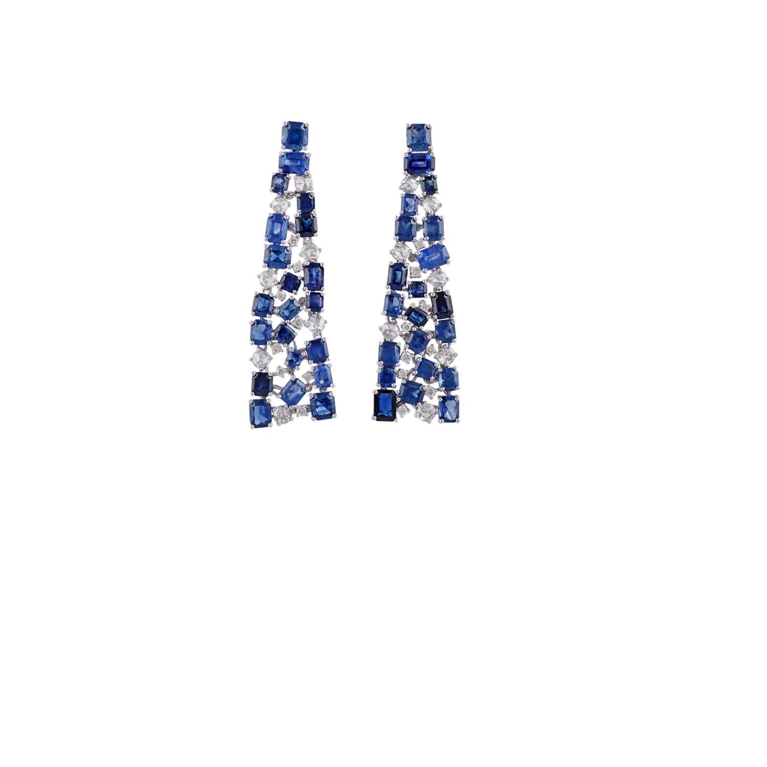 These are an elegant blue sapphire & diamonds earrings studded in 18k white gold features 42 pieces of octagon shaped blue sapphires weight 19 carat with 31 pieces of round shaped diamonds weight 1.85 carat, this earring pair entirely made of 18k