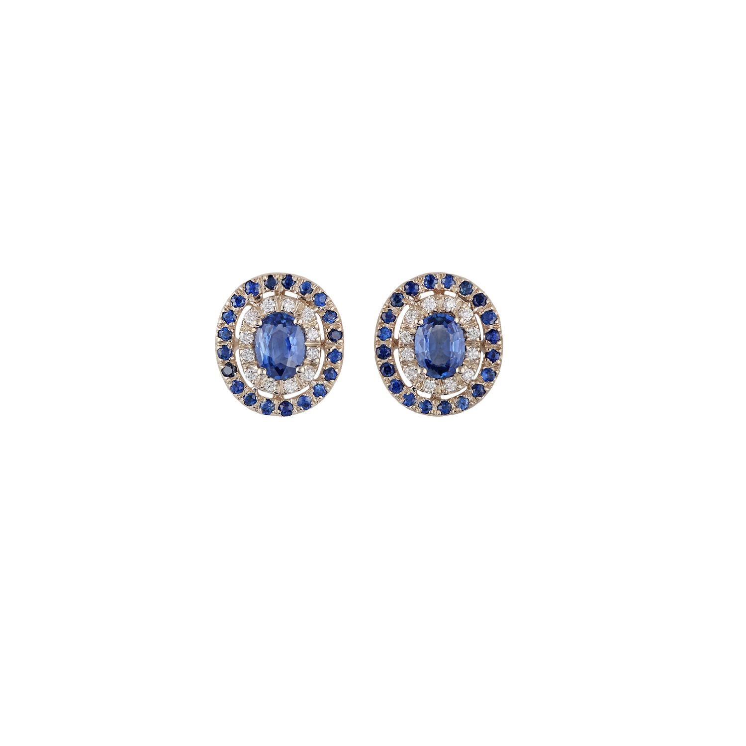 This is an elegant pair of blue sapphire cluster earrings, feature 2 pieces of oval-shaped blue sapphire weight 1.72 carats with 40 pieces of round-shaped blue sapphire weight 0.75 carat & 24 pieces of round shaped brilliant cut diamonds weight 0.23