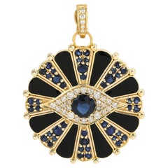 Pendentif en or jaune 18k saphir bleu et diamant oeil du mal