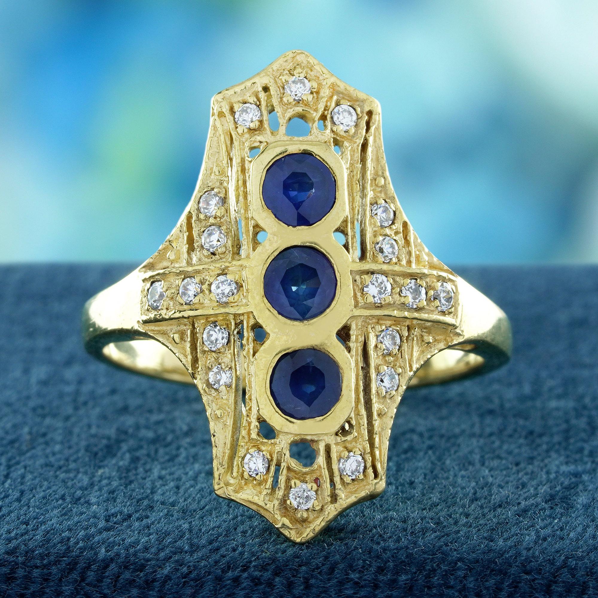 This Natural Blue Sapphire and Diamond Filigree Three Stone Ring showcases three stunning deep blue sapphires Surrounded by sparkling diamonds on either side. The vibrant sapphire takes center stage, while the diamonds add brilliant contrast and