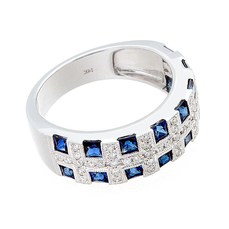 A half circle band set in 14K white gold with 1.28 carats of princess cut blue sapphires separated by 0.30 carats of round cut diamonds.

Currently ring size 7