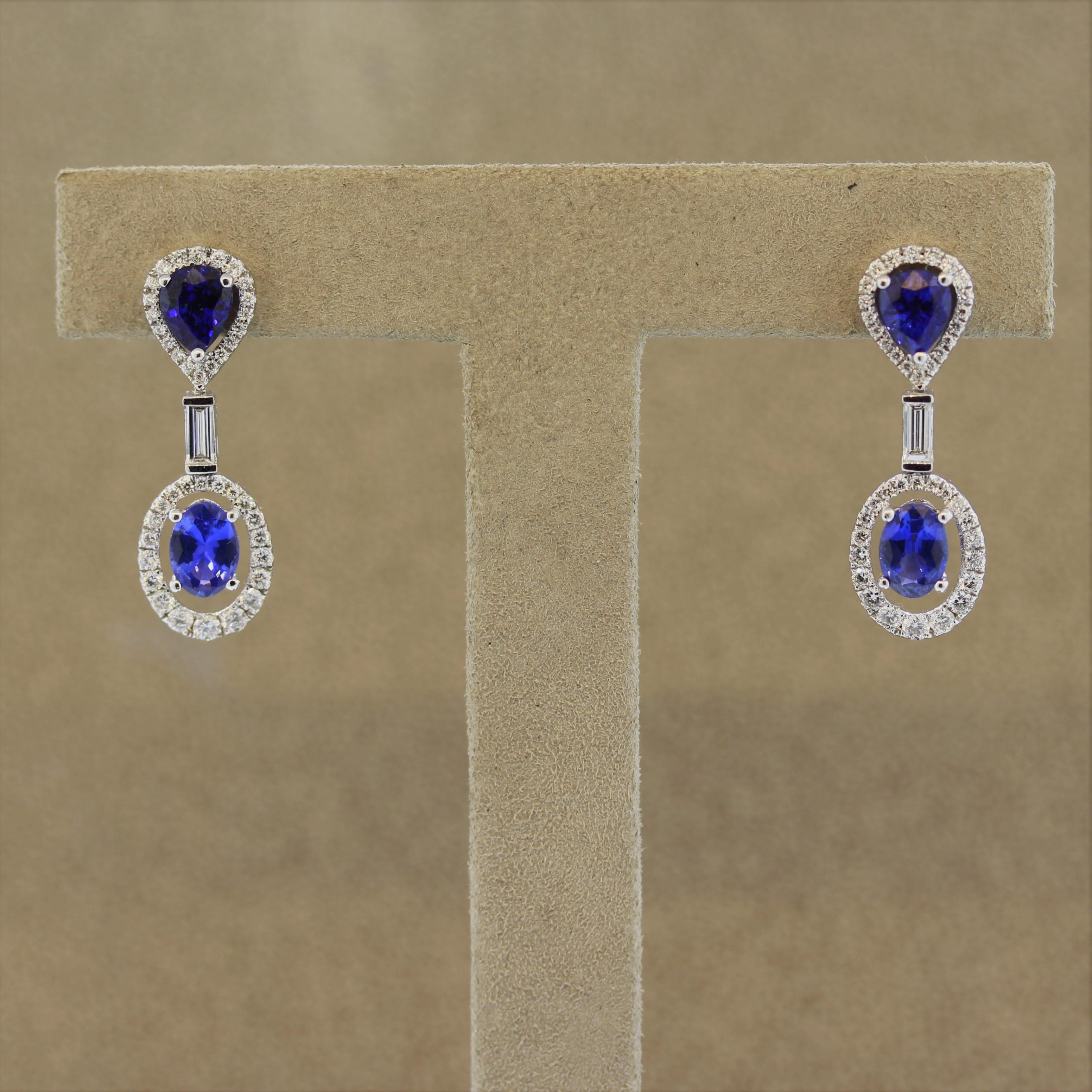 A lovely pair of drop earrings featuring 1.45 carats of blue sapphire. They are complemented by 1.01 carats of round brilliant and baguette cut diamonds set in 18k white gold.

Length: 1.1 inches