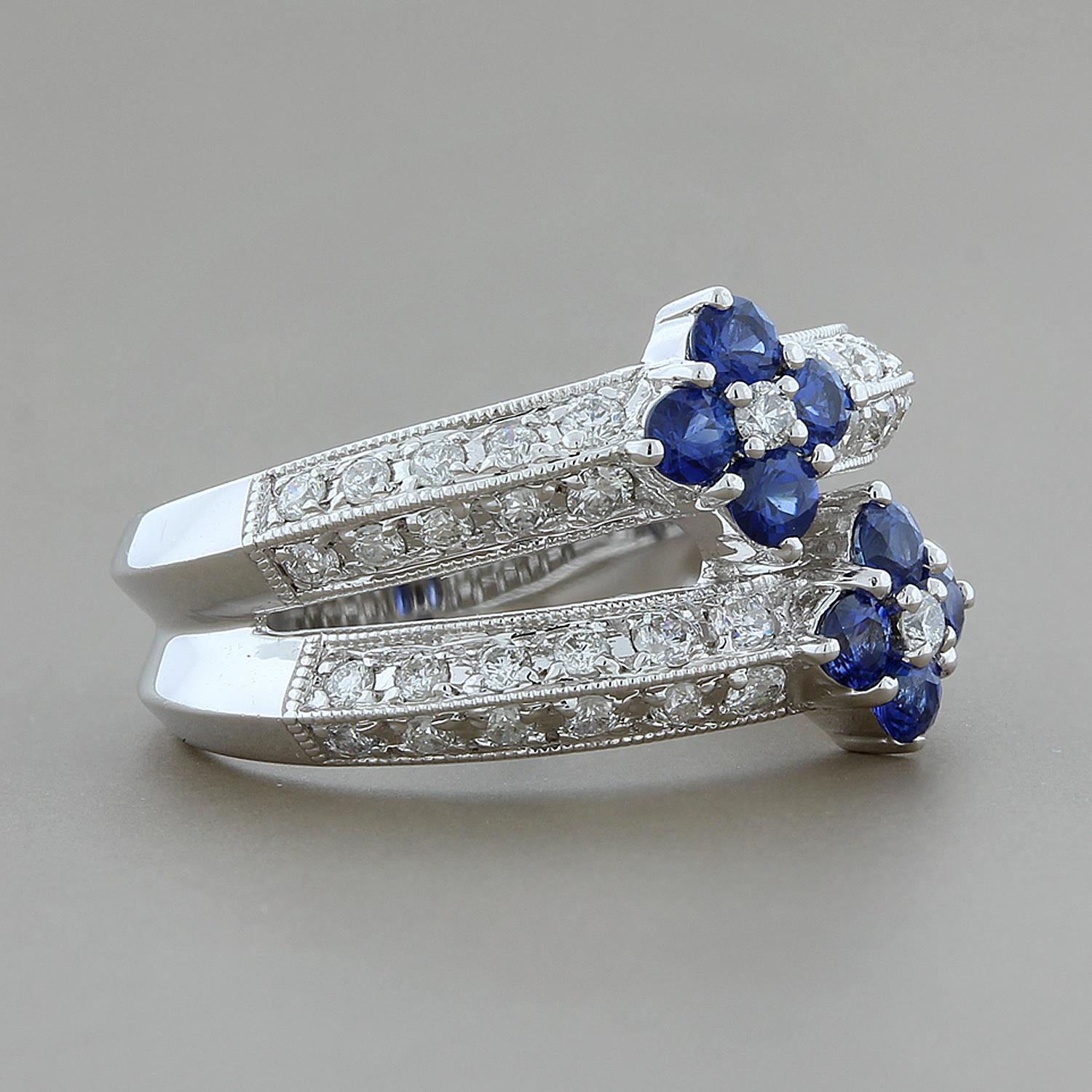 This ultra-feminine ring features 0.40 carats of ocean blue sapphires clustered together creating two florets.  It is accented by 0.70 carats of diamonds on a 14K white gold split shank.

Currently ring size 6.25