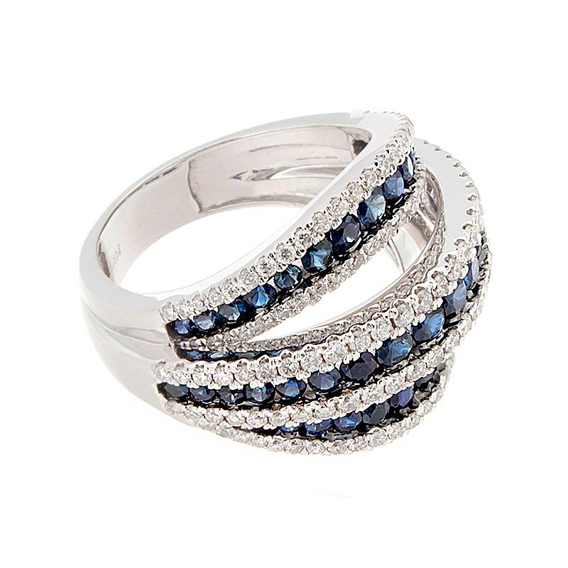 Fun and fashionable! This fabulous ring boasts 2.00 carats of round cut matching blue sapphires on three bands that converge into one shank with 1.38 carats of brilliant round diamonds.  Set in 14K white gold.

Currently ring size 6.75