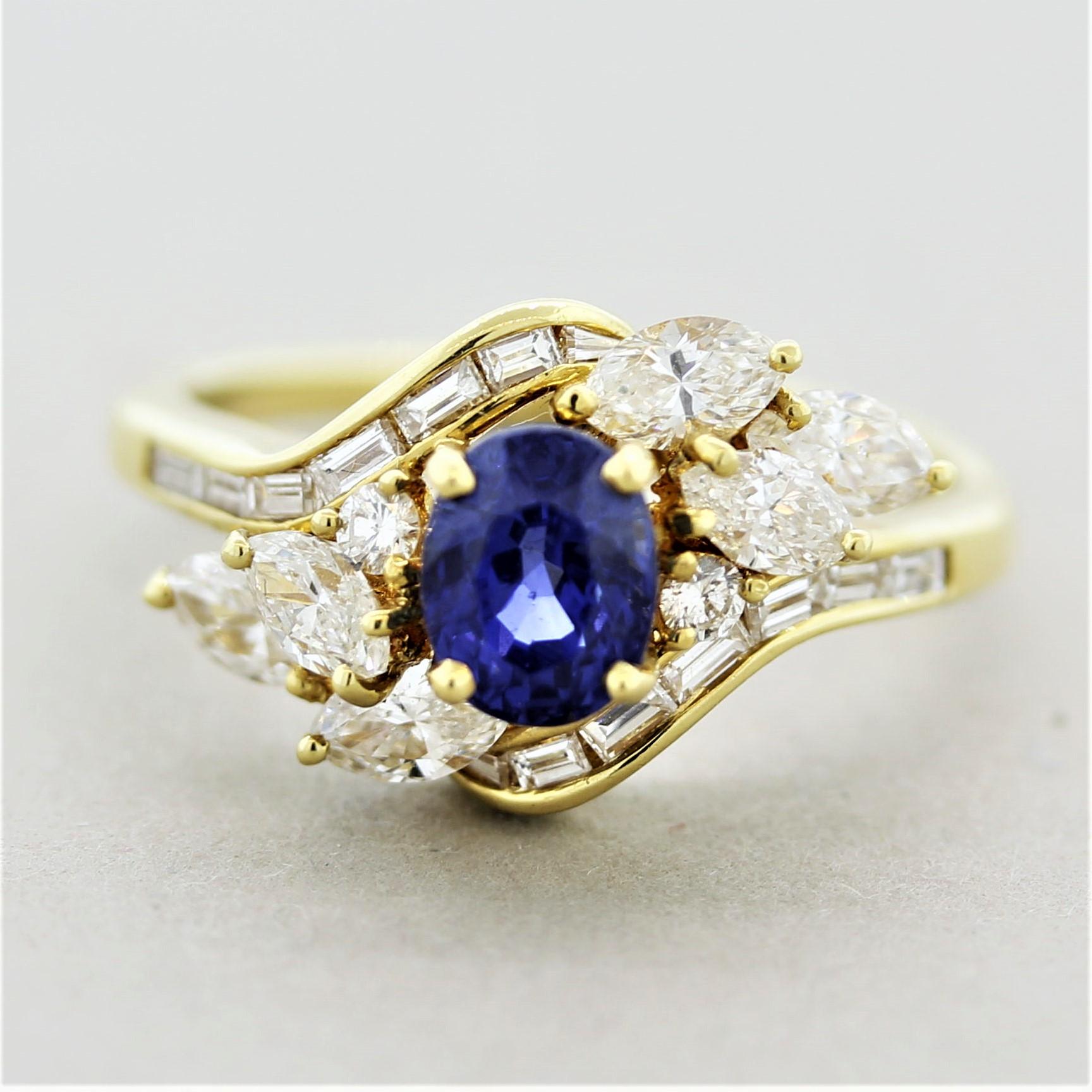 A sweet and stylish spray ring featuring a 1.00 carat oval-shaped sapphire. It has a bright and lovely blue color with excellent brilliance and sparkle. It is accented by 0.90 carats of round brilliant, marquise and baguette-cut diamonds set in a
