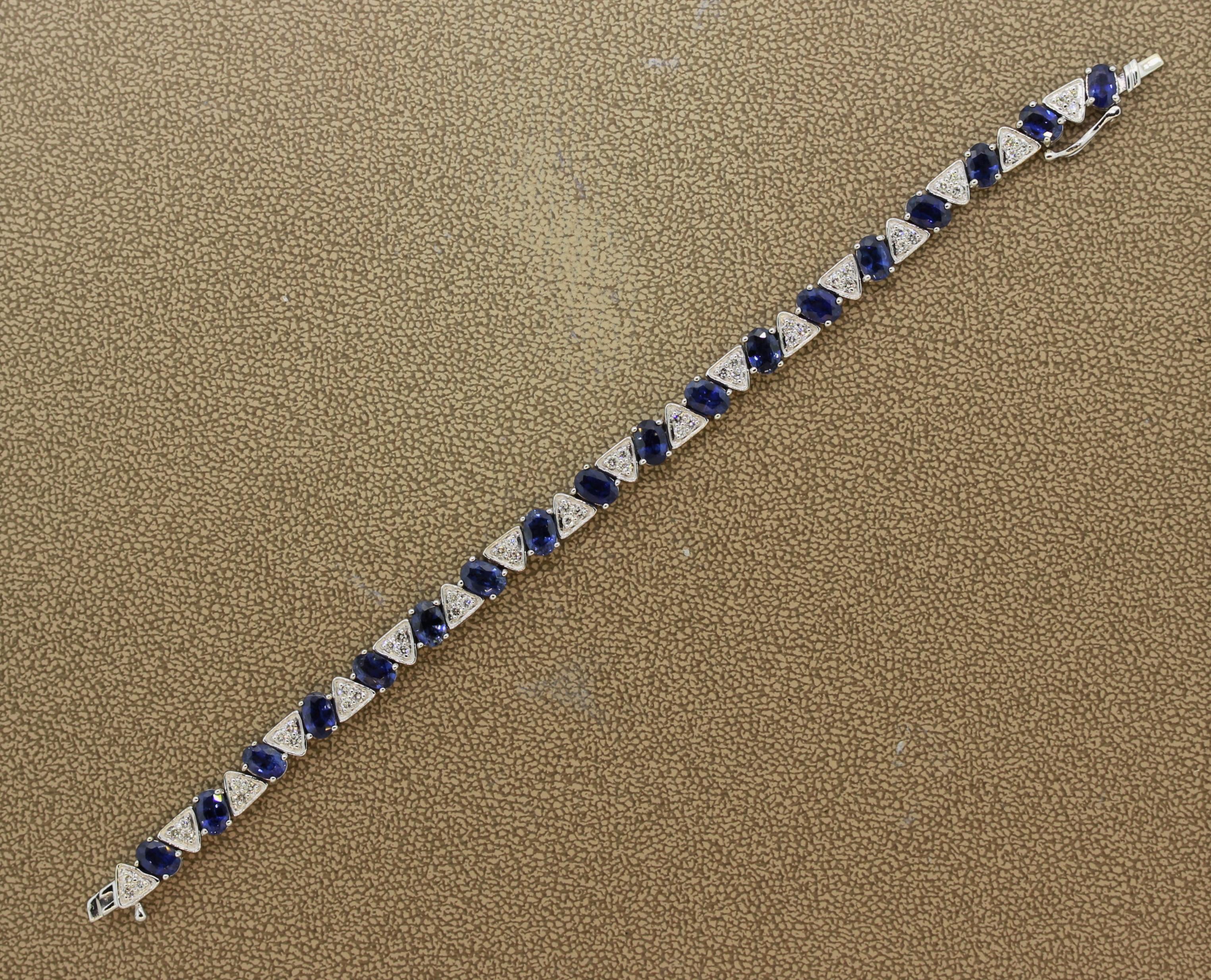 A lovely tennis bracelet featuring oval shaped blue sapphires weighing a total of 11.36 carats. They are accented by 1.16 carats of round brilliant cut diamonds set in clusters of 3 between each sapphire. Made in 14k white gold and comfortable to