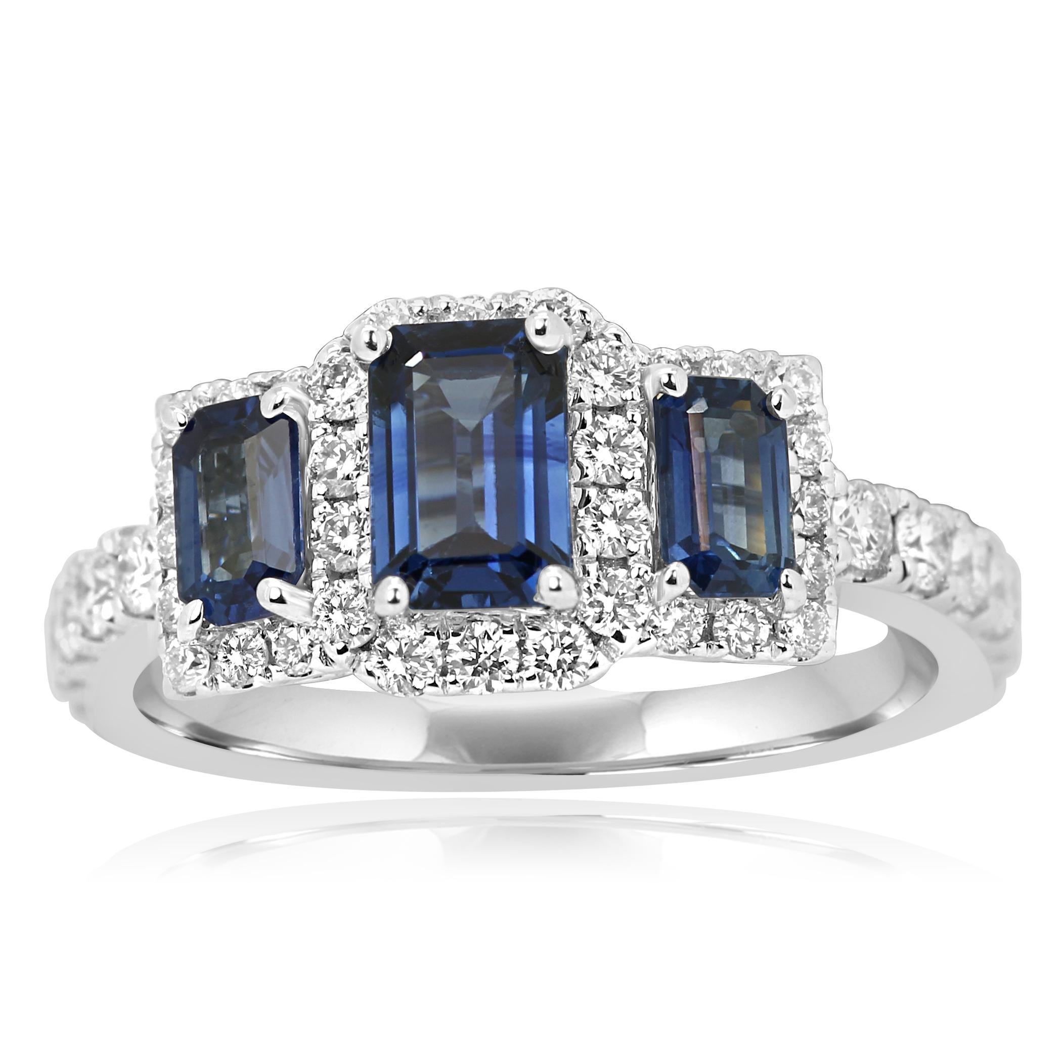 3 Blue Sapphire Emerald Cut 1.39 Carat encircled in a single Halo of Colorless VS-SI Clarity Round Brilliant Diamonds 0.70 Carat Set in stunning 14K White Gold Three Stone Cocktail Ring.

Style available in different price ranges. Prices are based