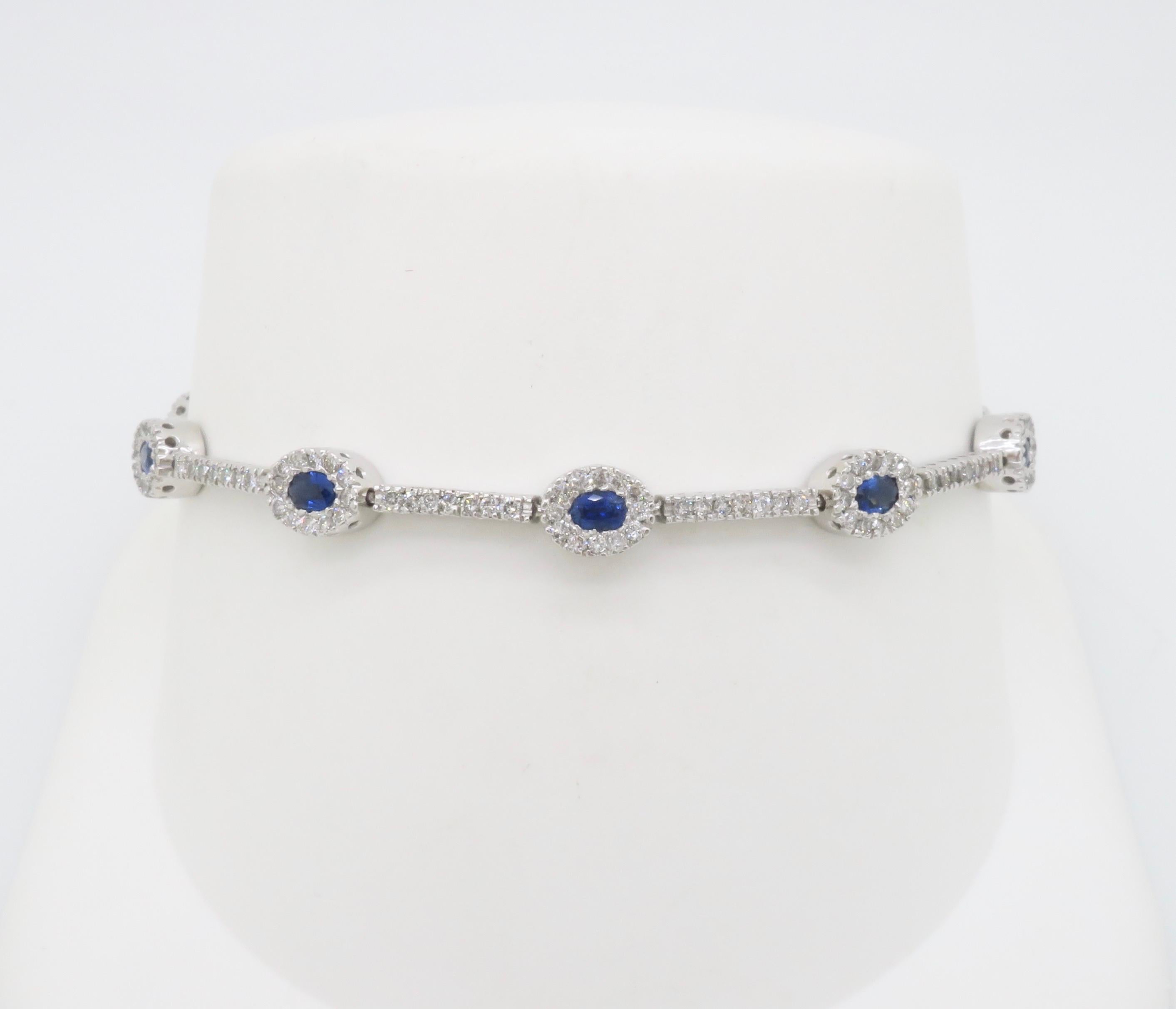 Oval Cut Blue Sapphire & Diamond Halo Line Bracelet in White Gold  For Sale