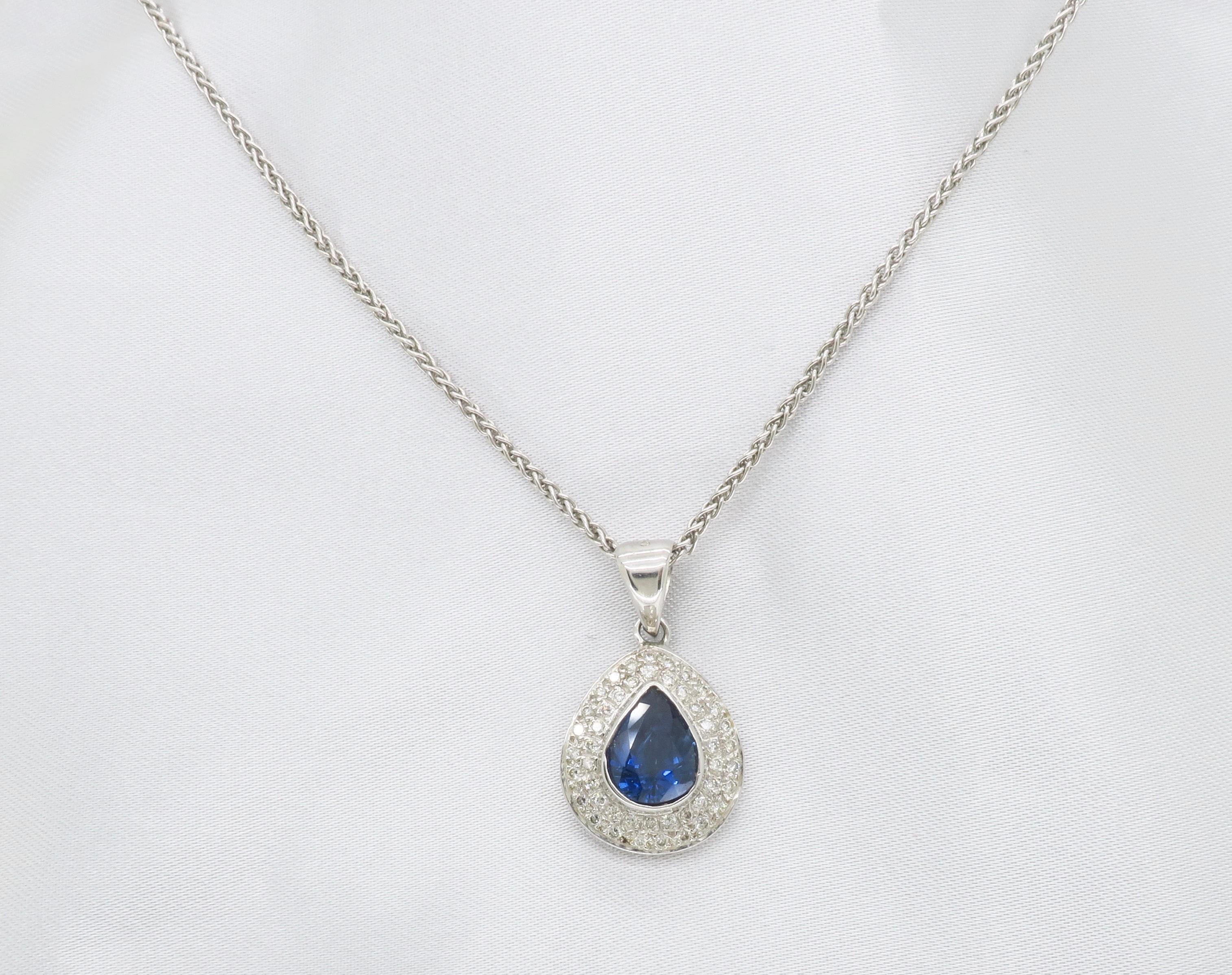 blue sapphire and diamond halo necklace