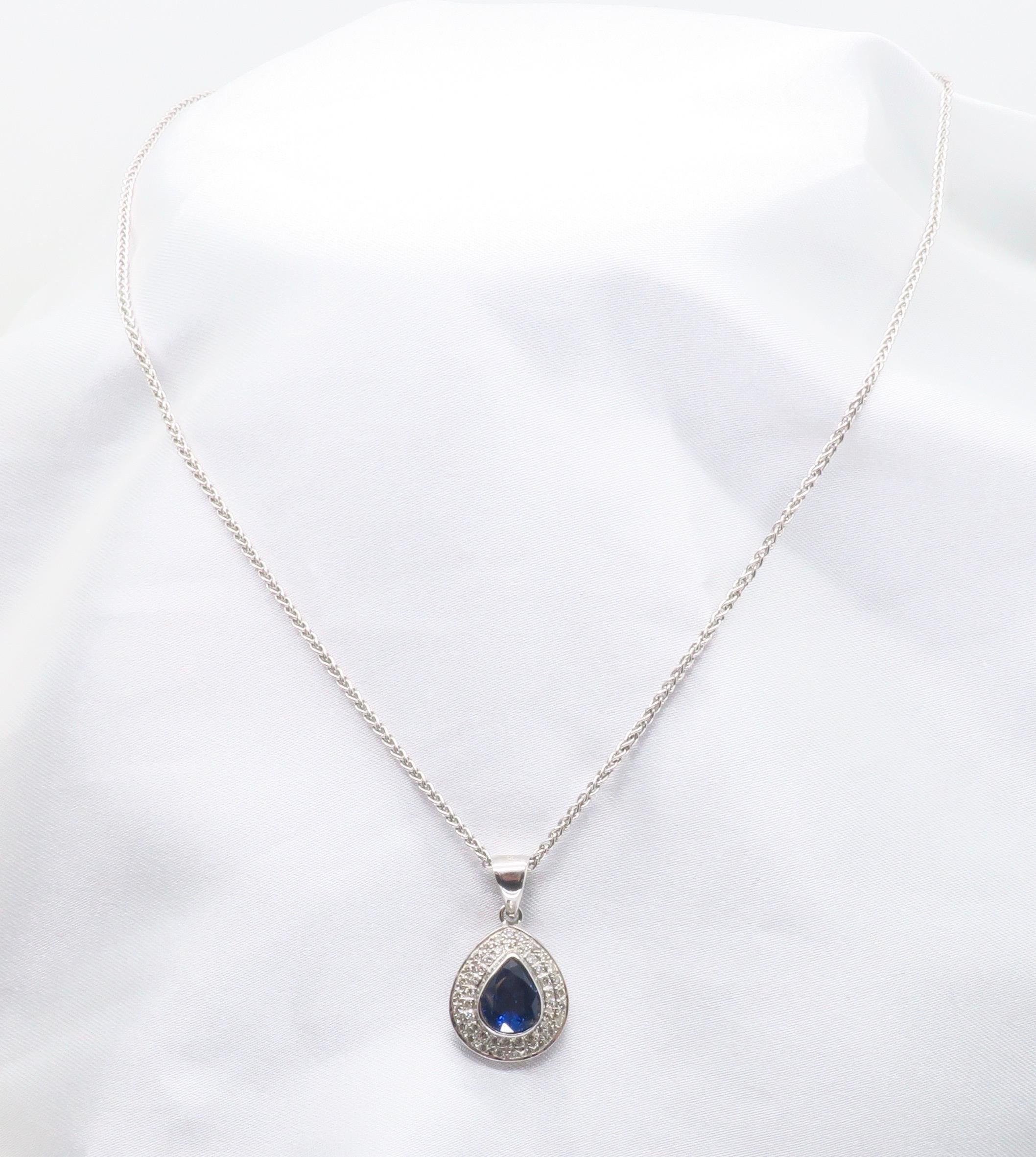 Pear Cut Blue Sapphire & Diamond Halo Pendant Necklace in 18k For Sale