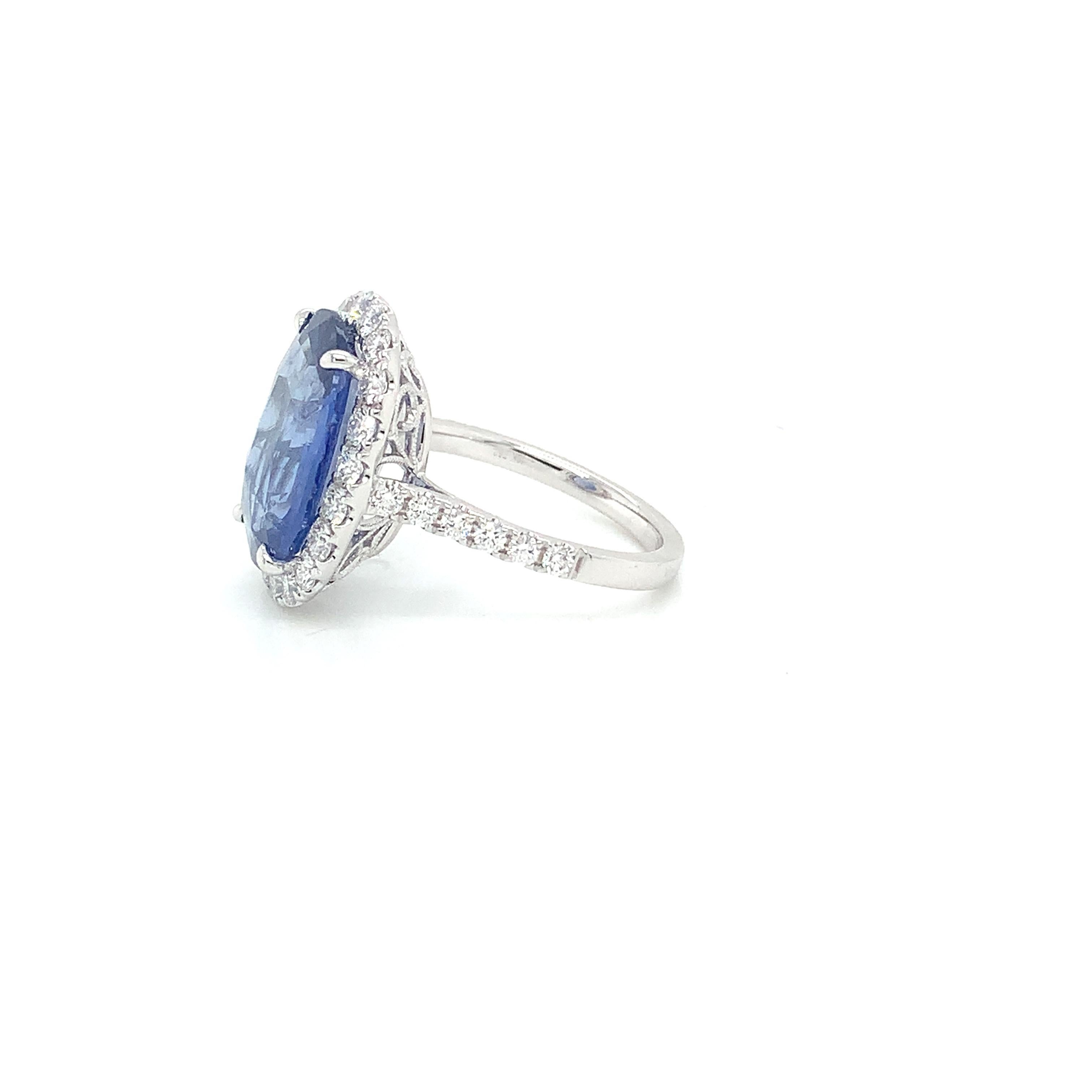 Oval Cut Blue Sapphire & Diamond Halo Ring in 18 Karat White Gold
