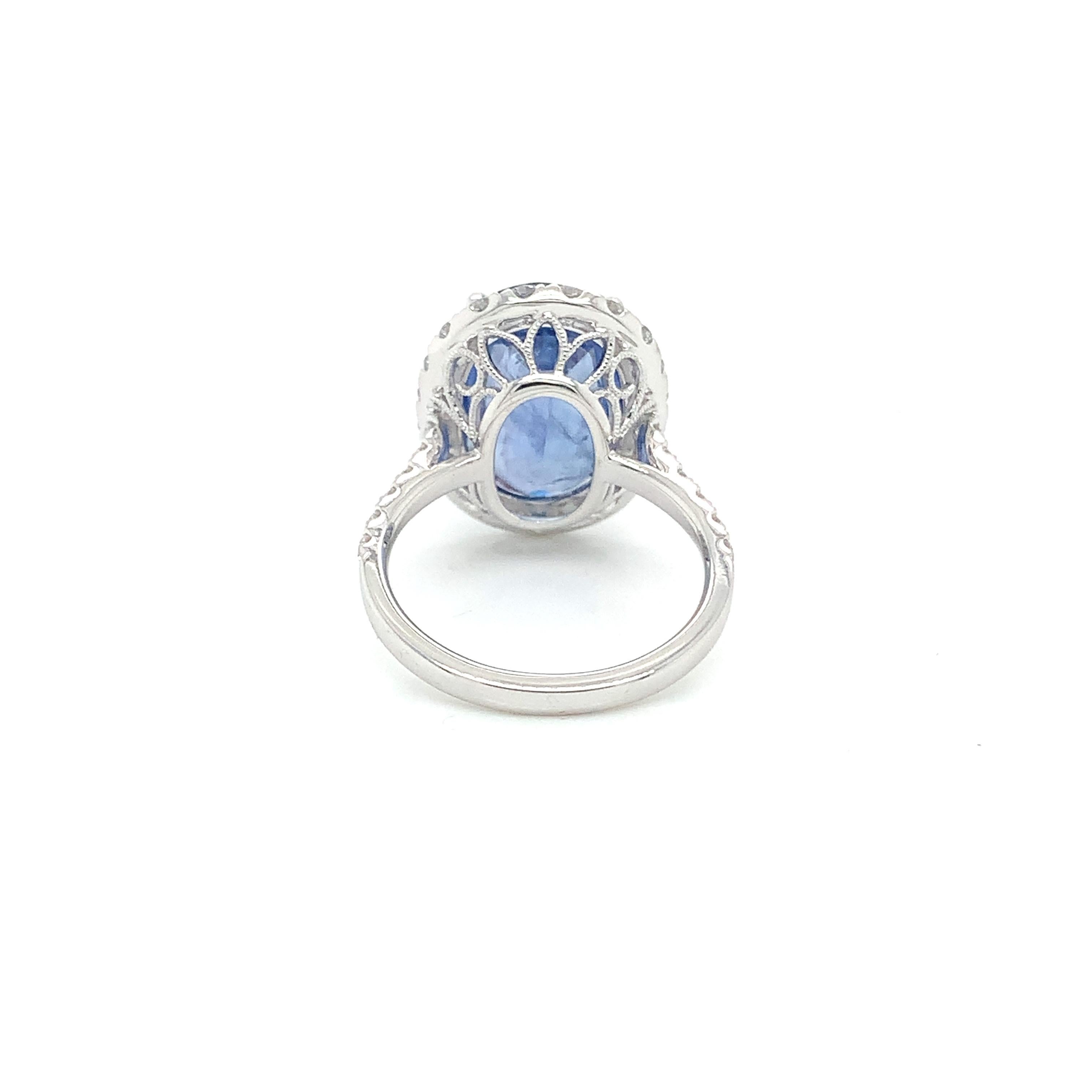 Blue Sapphire & Diamond Halo Ring in 18 Karat White Gold In New Condition In Great Neck, NY