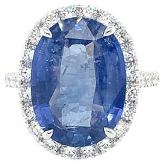 Blue Sapphire & Diamond Halo Ring in 18 Karat White Gold
