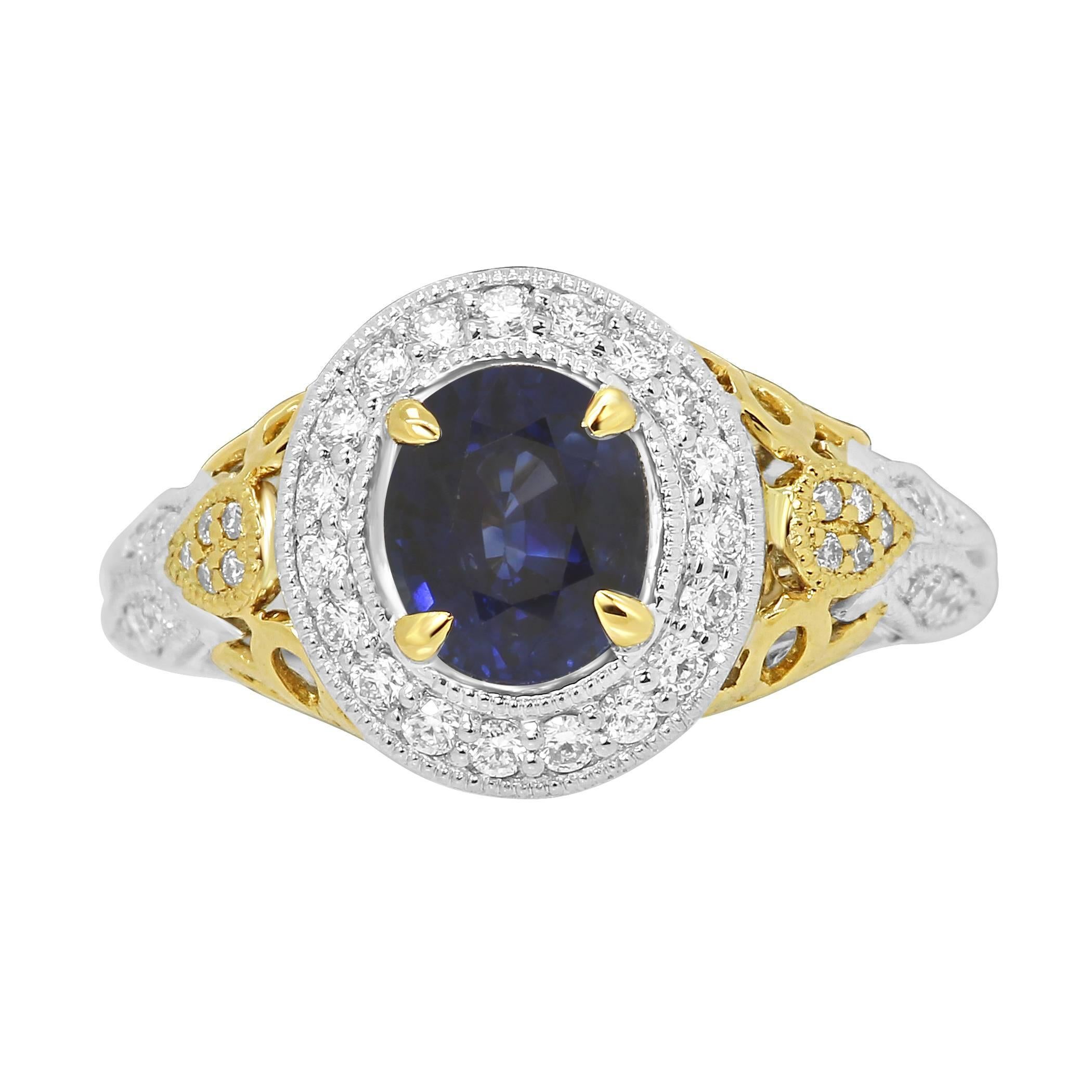 Stunning Heated Blue Sapphire Oval 1.43 Carat encircled in a single Halo of White Round Diamonds 0.37 Carat in 14K White and Yellow Gold.

Total Stone Weight 1.80 Carat