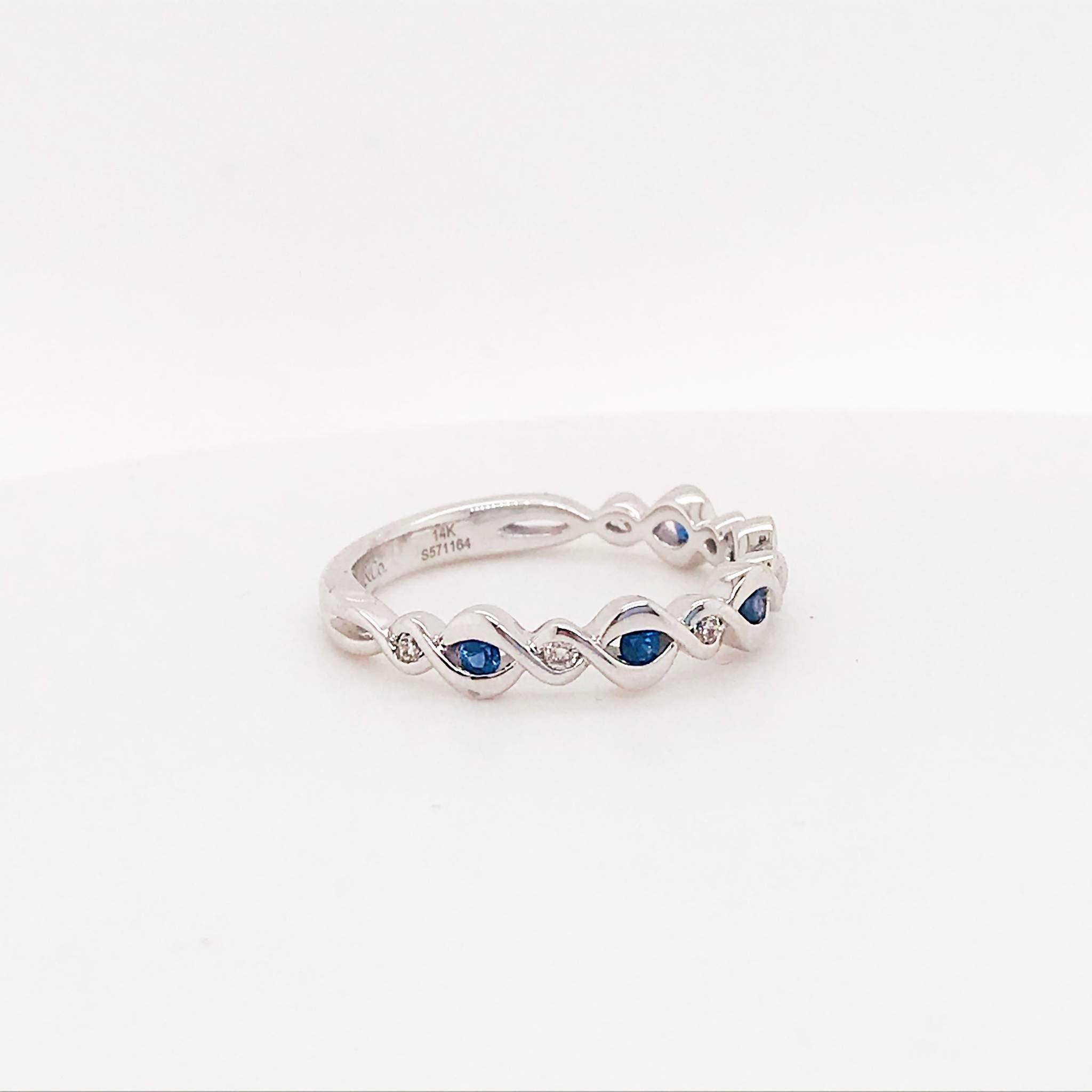 Blue sapphire and diamond infinity band! This band has genuine blue sapphire gemstones set in between round brilliant diamonds. The gemstones and diamonds are set in a twist or infinity setting that symbolizes eternal love. This ring would make the