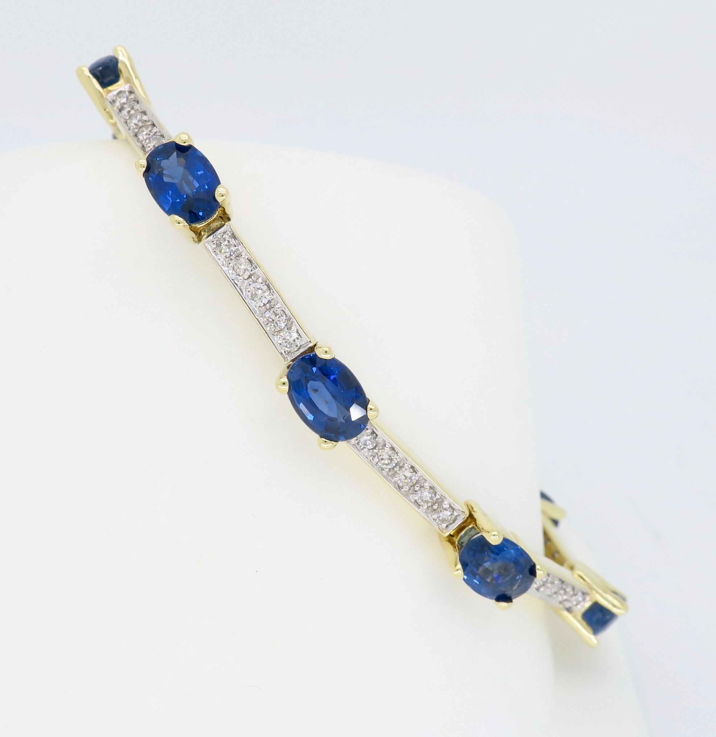 Bar link blue sapphire and diamond tennis bracelet crafted in 14k yellow gold.

Gemstone Carat Weight: Approximately 11.06 CTW Blue Sapphires
Diamond Carat Weight:  Approximately .96CTW
Diamond Cut: Round Brilliant Cut
Color: Average G-I
Clarity: