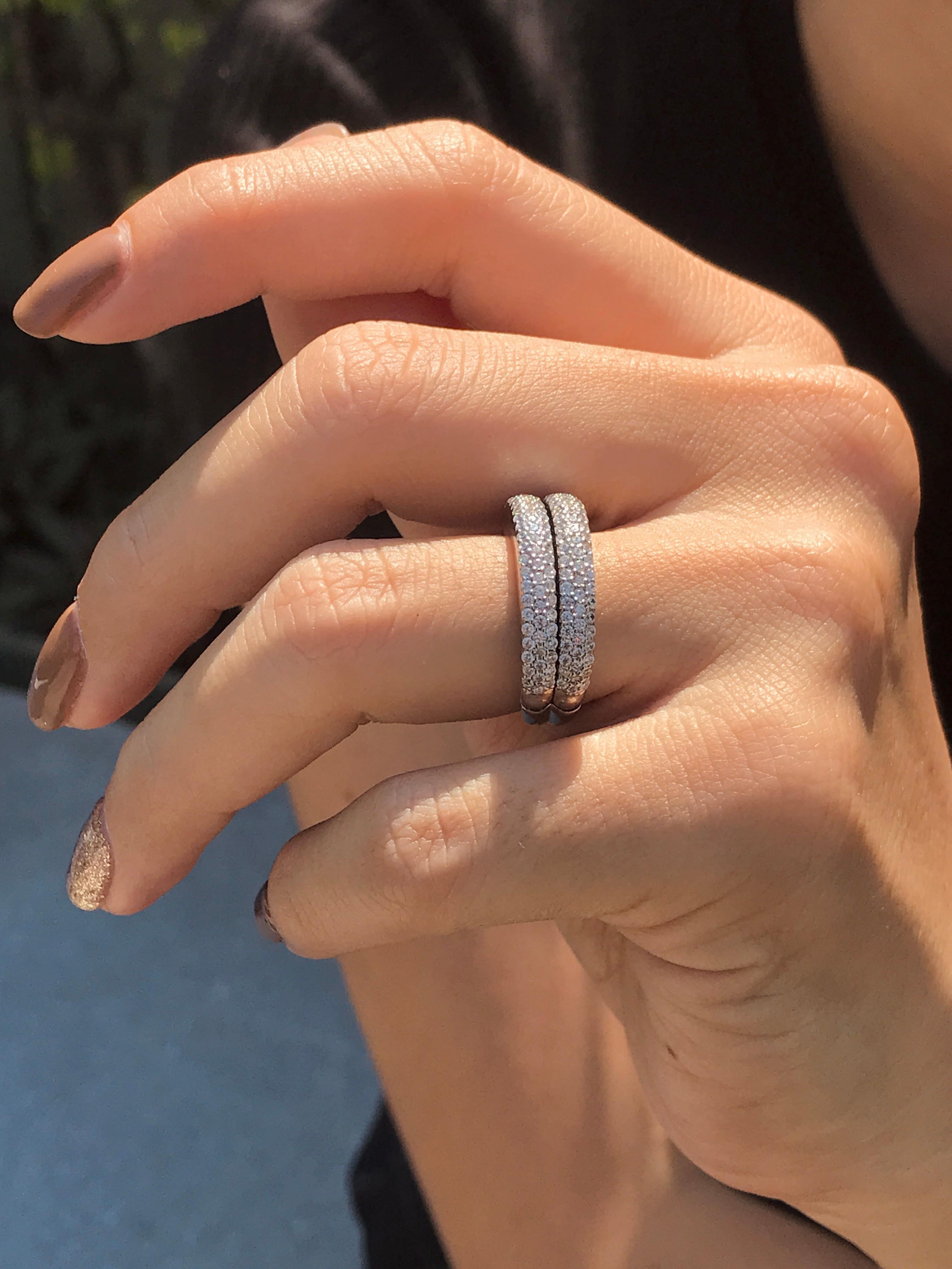 This elegant open-close band ring showcases a sleek row of French-cut blue sapphires at the center, offering rich color and clean symmetry. Flanked above and below by rows of sparkling diamonds, the design creates a striking contrast and refined