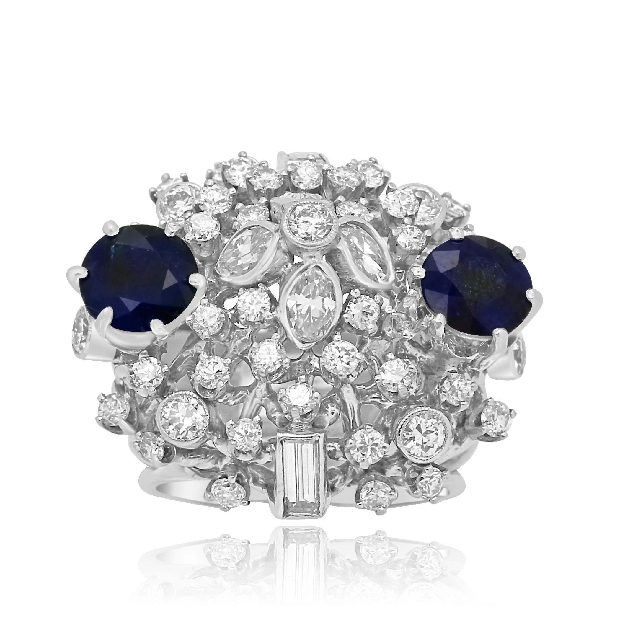 2 Blue Sapphire Round Approximate Weight 2.00 Carat with White Marquis, Baguettes and round diamonds approximate weight 2.10 carats in Platinum Hand Made one of a kind Ring.

Approximate Blue Sapphire Weight 2.00 Carat
Approximate Total Weight 4.10