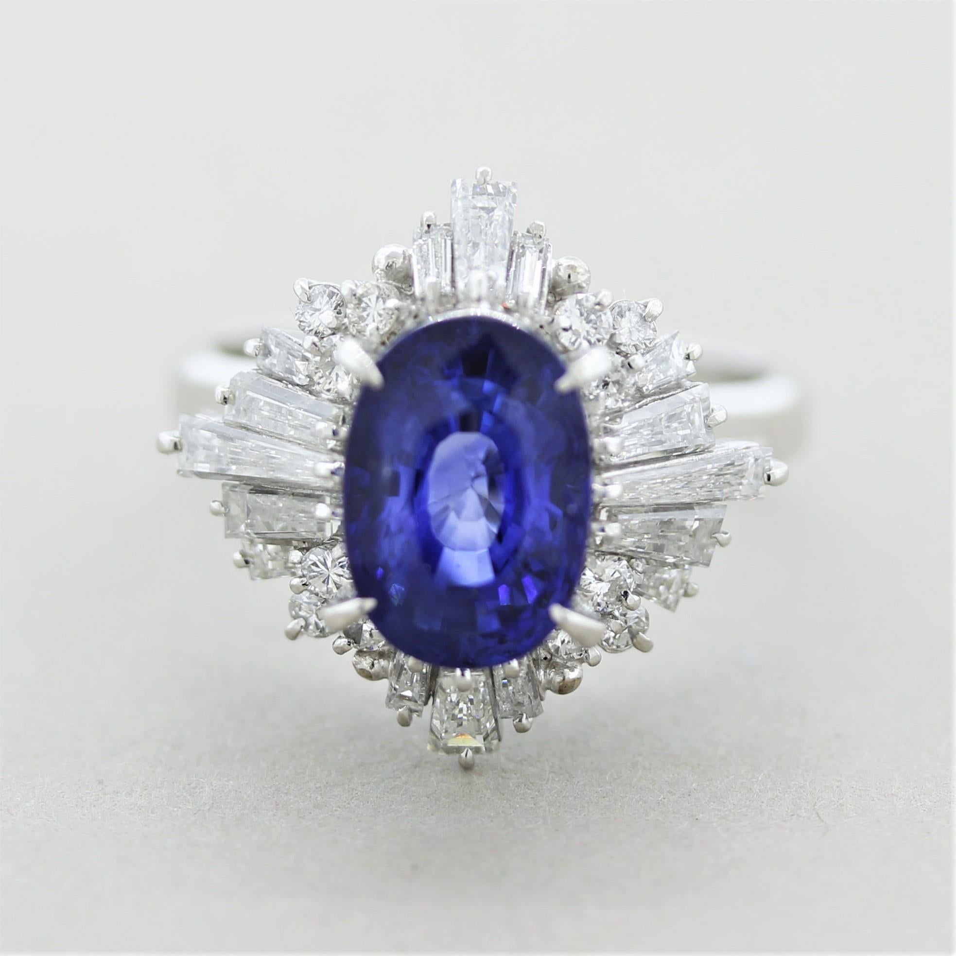 A bright and lively natural sapphire certified by the GIA! It weighs 4.08 carats and has a brilliant vivid-blue color that absolutely shines. It is accented by 1.44 carats of round brilliant-cut and baguette-cut diamonds set around the sapphire in a