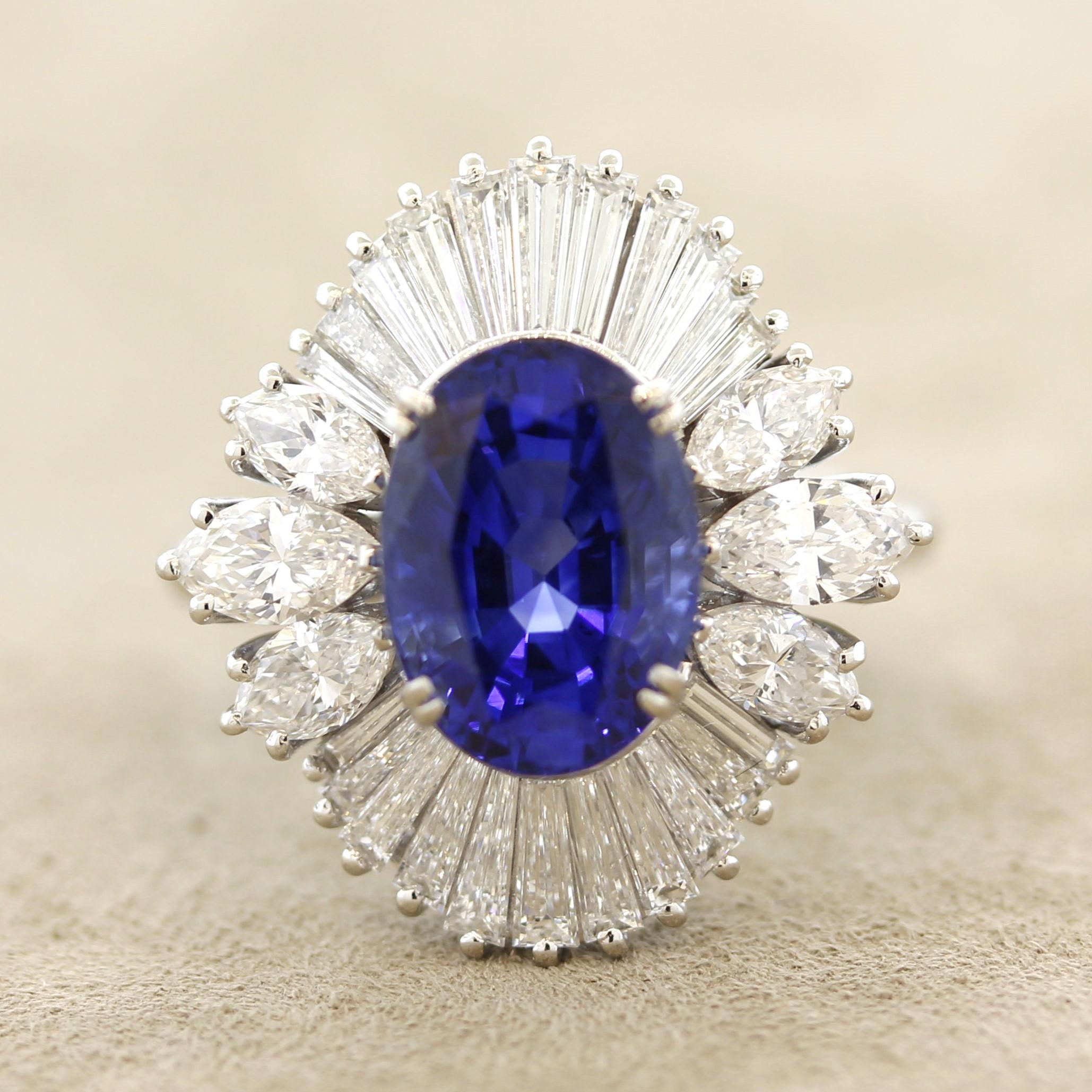 A gem blue sapphire, certified by the GIA, takes center stage of this lovely platinum ring. The sapphire weighs just shy of 5 carats, 4.97 carats, and has a royal vivid blue color which is still bright and clear, a true gem. It is complemented by