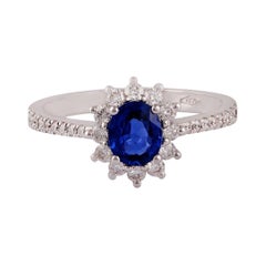 Bague en or blanc 18 carats cloutée de saphir bleu et de diamants