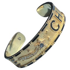 Pulsera tipo brazalete con zafiro azul, diamantes y estrella fugaz, esmalte negro